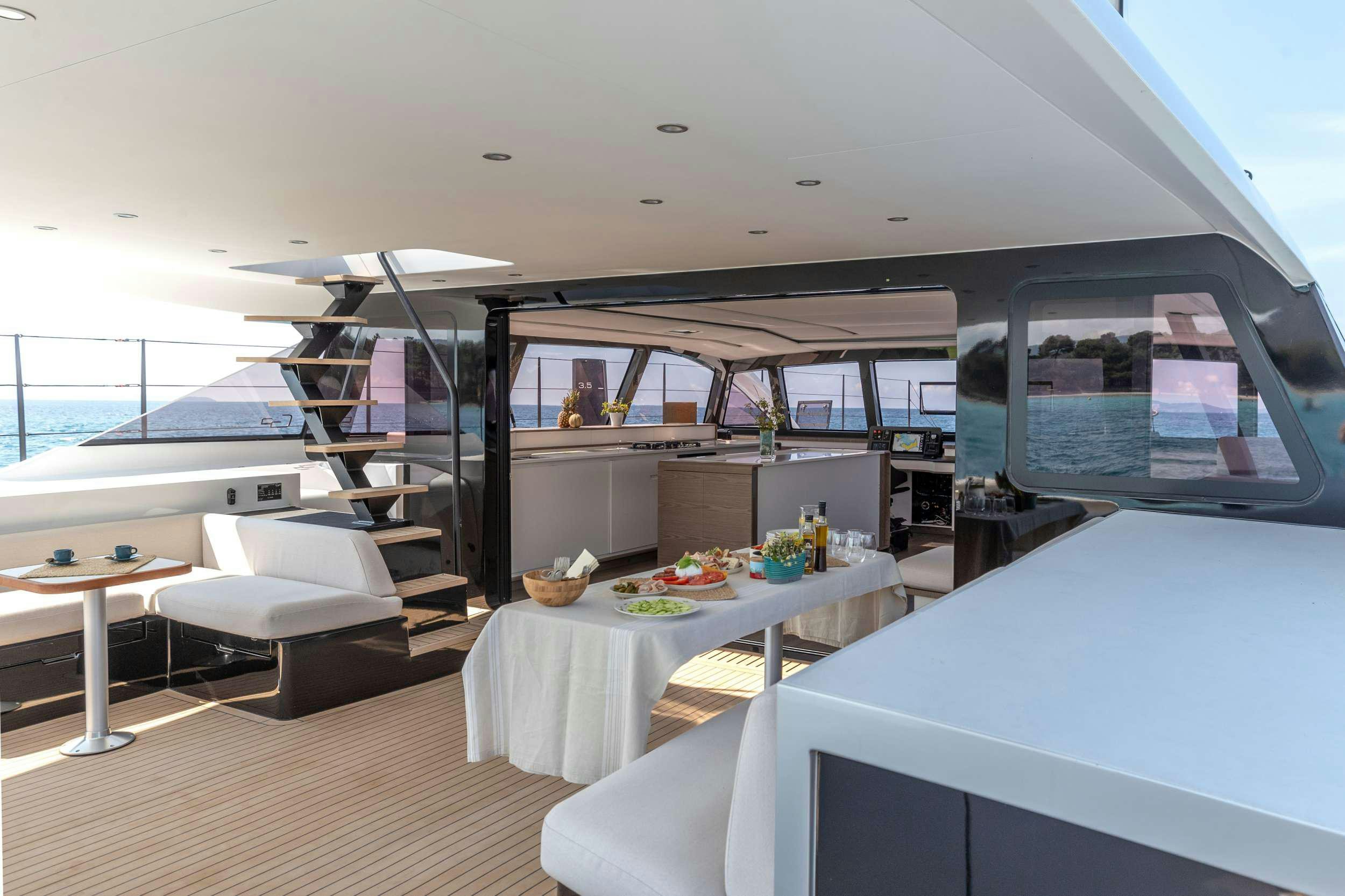 a room with a table and a bed aboard WONDERFUL Yacht for Charter