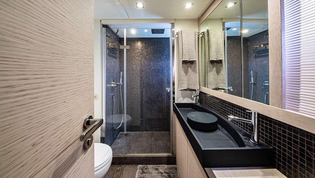 a bathroom with a sink and a shower aboard LOKI Yacht for Charter