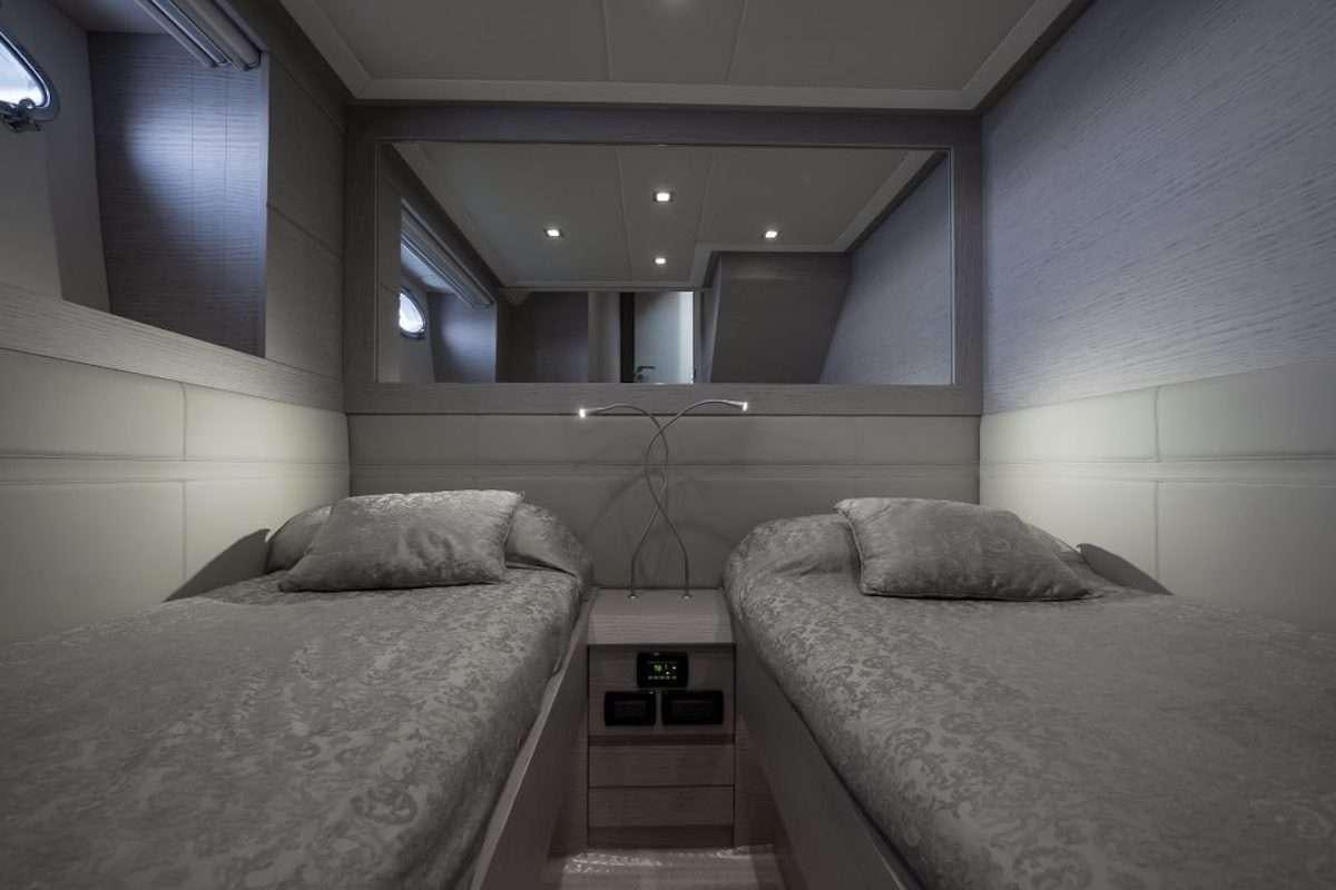 a room with two beds aboard LOKI Yacht for Charter