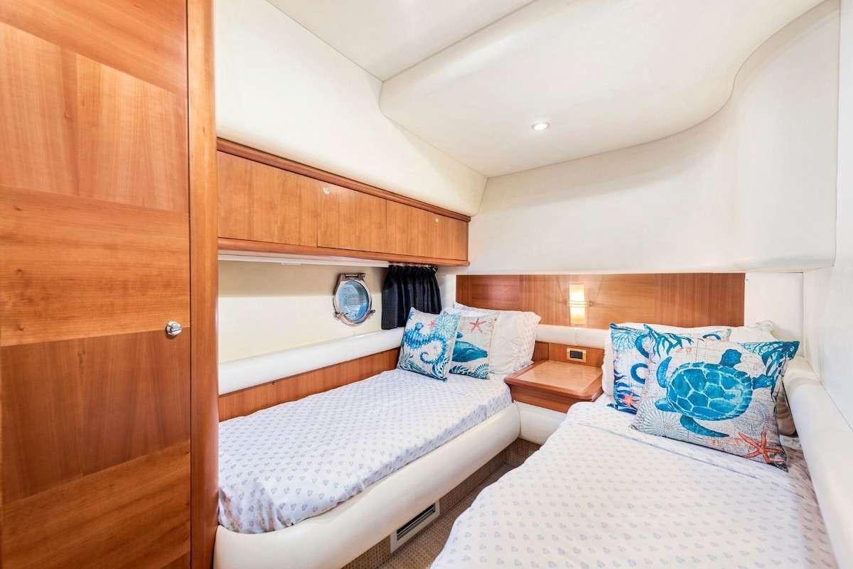 a couple of beds in a room aboard KOWBOY BABY Yacht for Charter