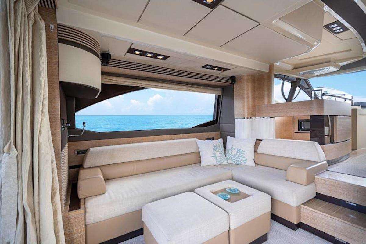 a living room with a large window aboard BLUE SEA Yacht for Charter