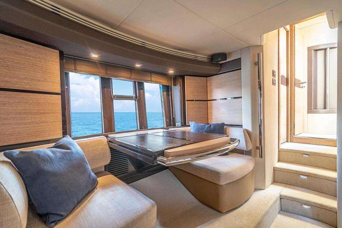 a room with a couch and a table aboard BLUE SEA Yacht for Charter