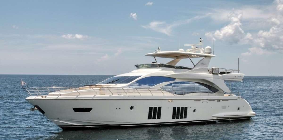 a white yacht on the water aboard 86  ITALIAN Yacht for Charter