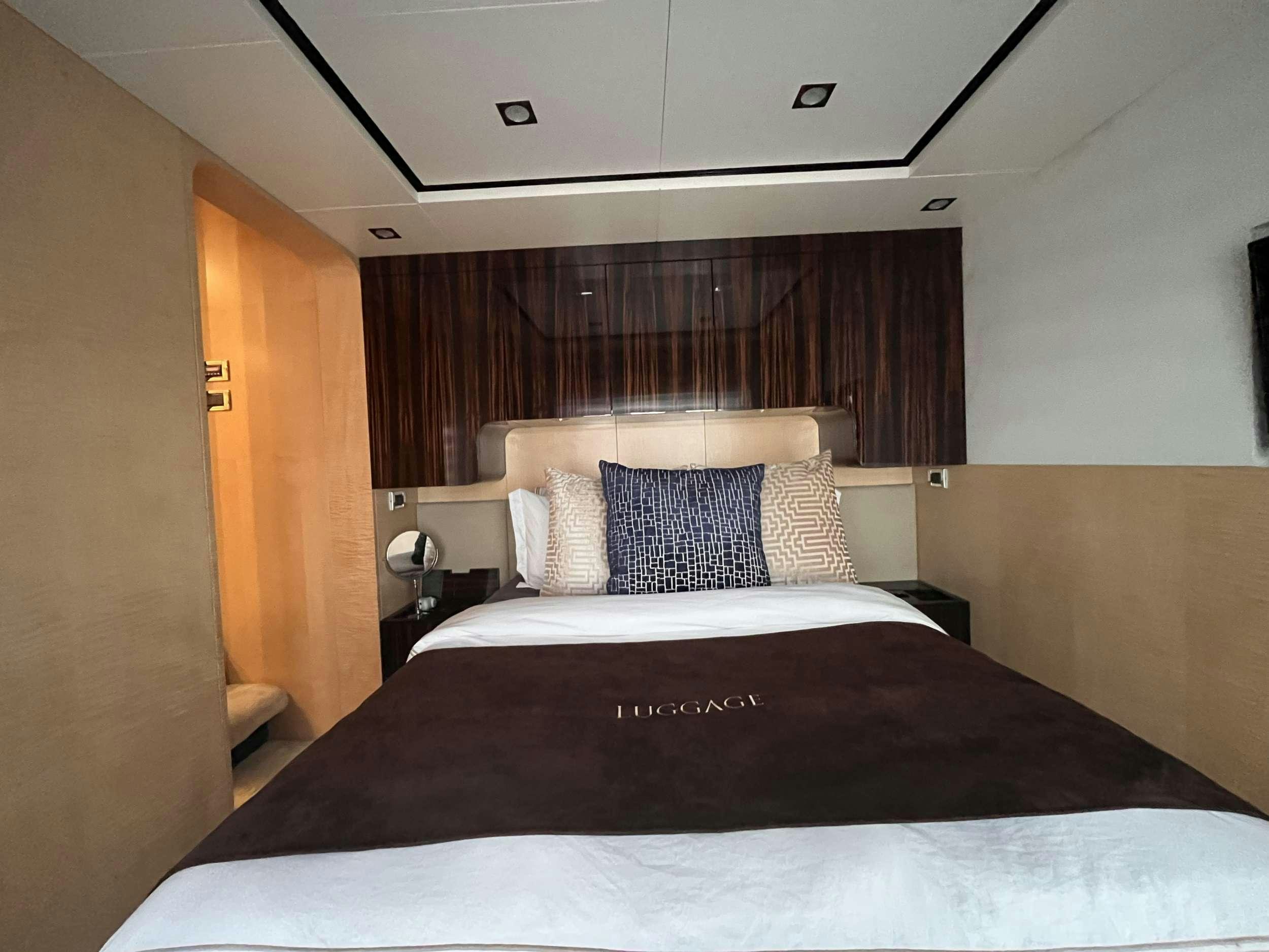 a hotel room with a bed aboard 86  ITALIAN Yacht for Charter