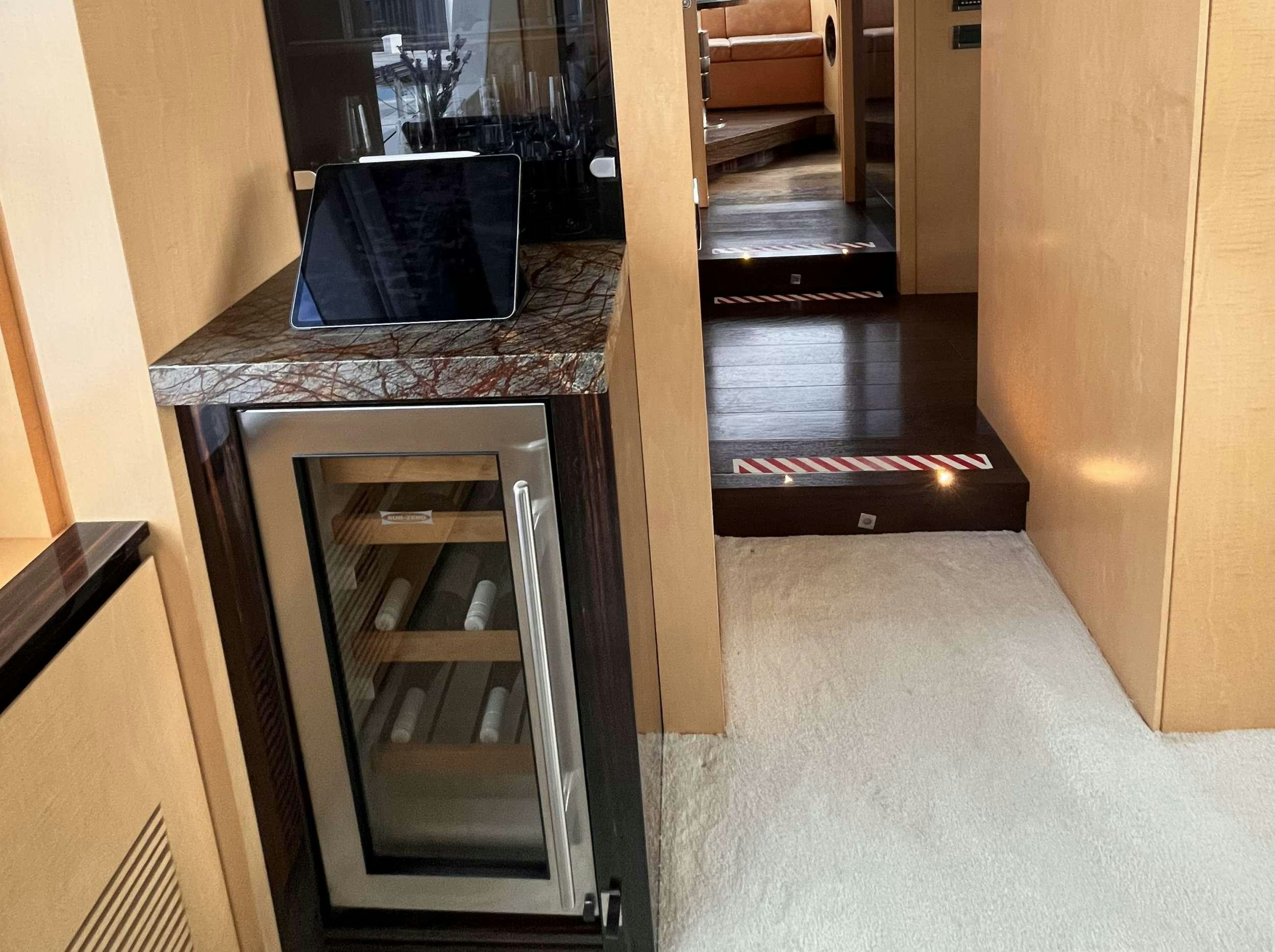 a room with a table and chairs aboard 86  ITALIAN Yacht for Charter