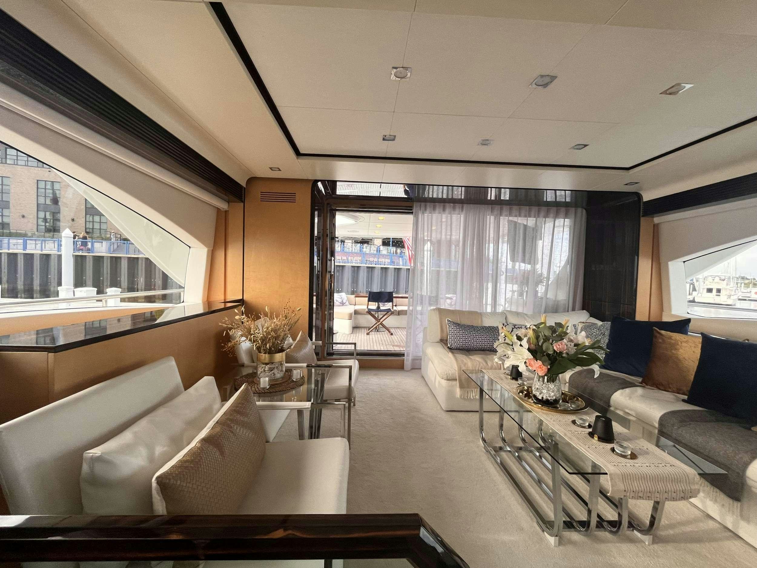 a living room with a large window aboard 86  ITALIAN Yacht for Charter
