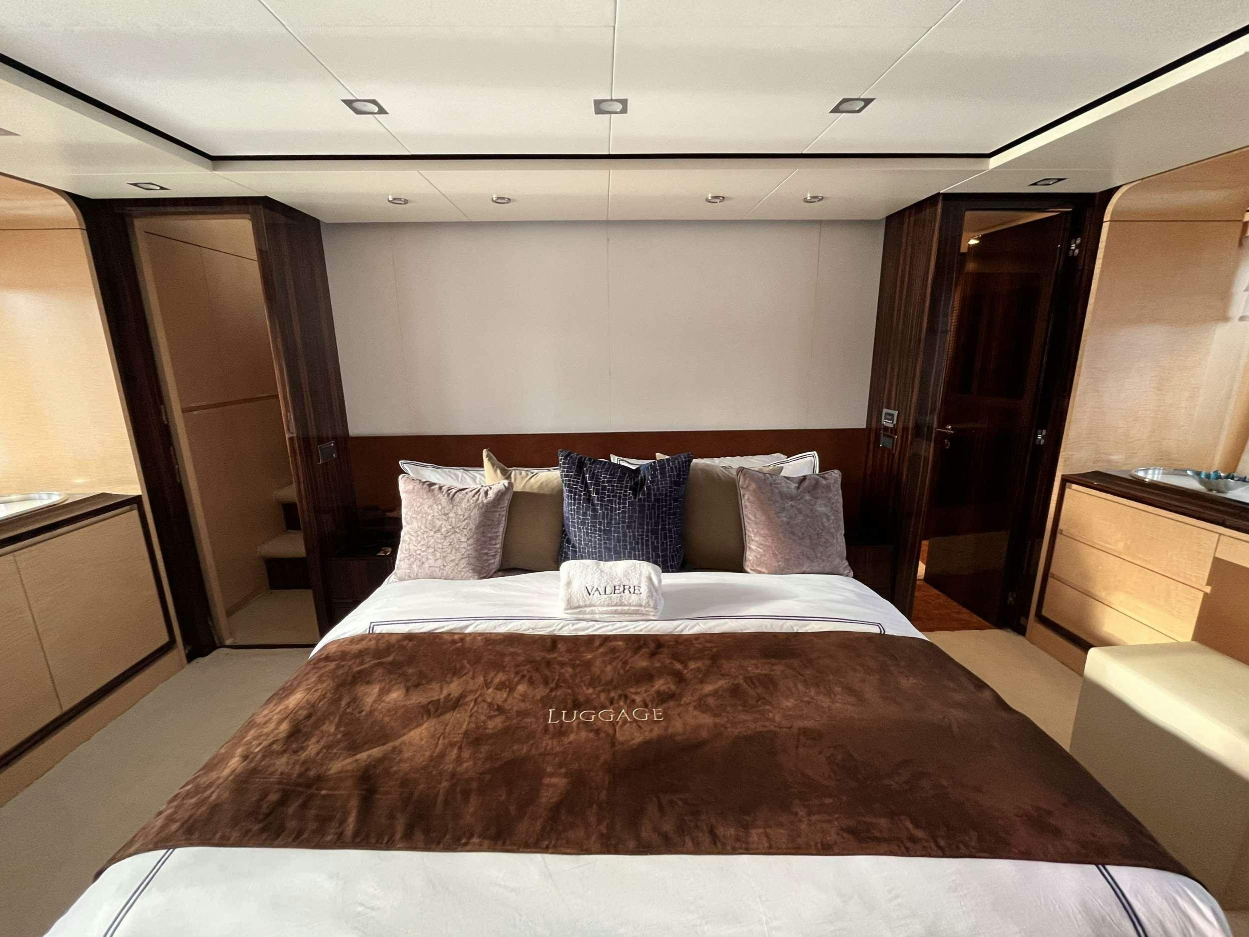 a bed with pillows aboard 86  ITALIAN Yacht for Charter