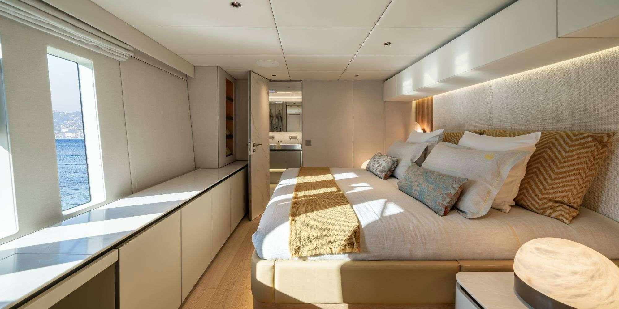 a bed in a room aboard APOLLO 99 Yacht for Charter