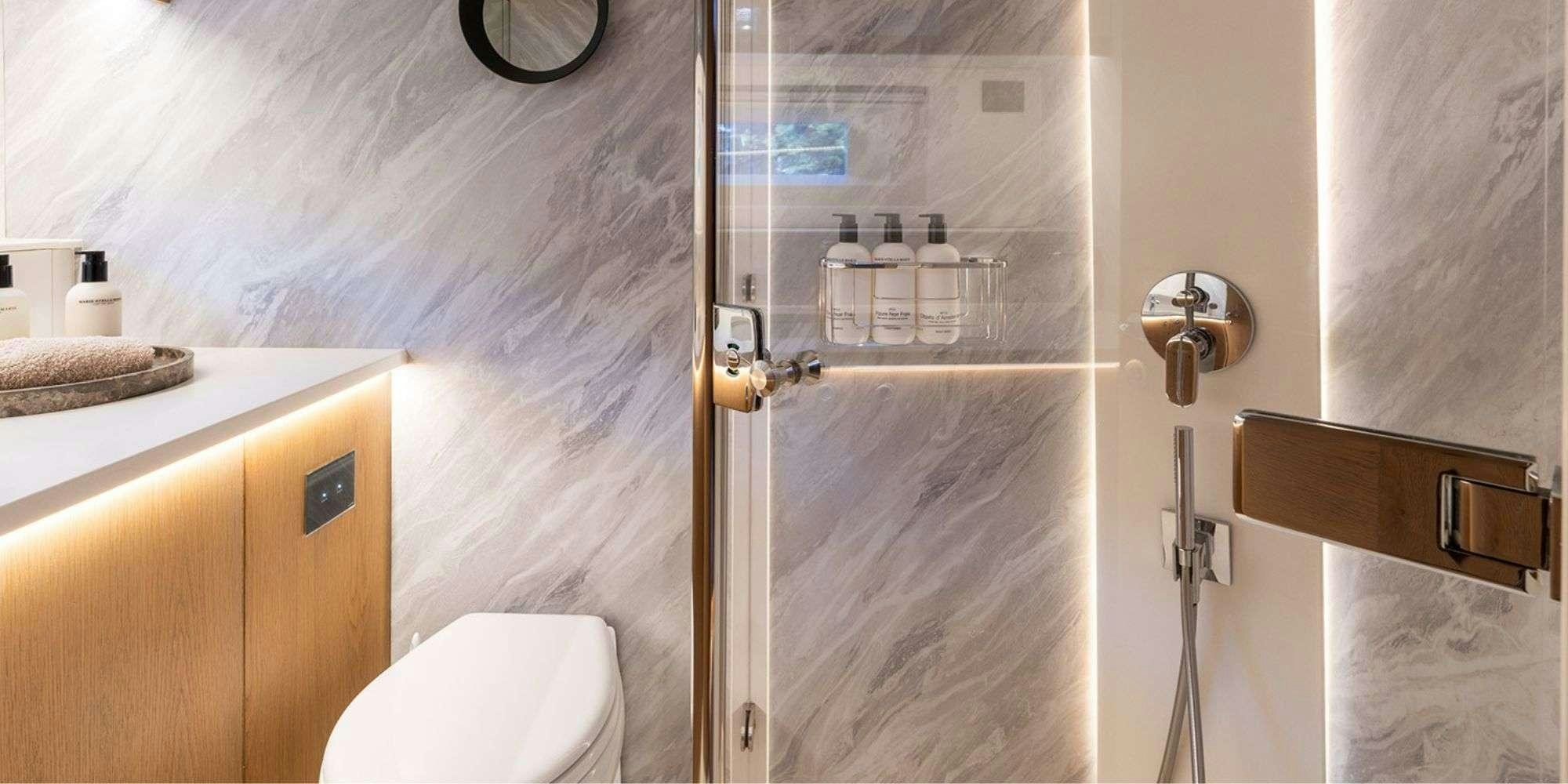 a shower with a glass door aboard CHAMPAGNE HIPPY Yacht for Charter