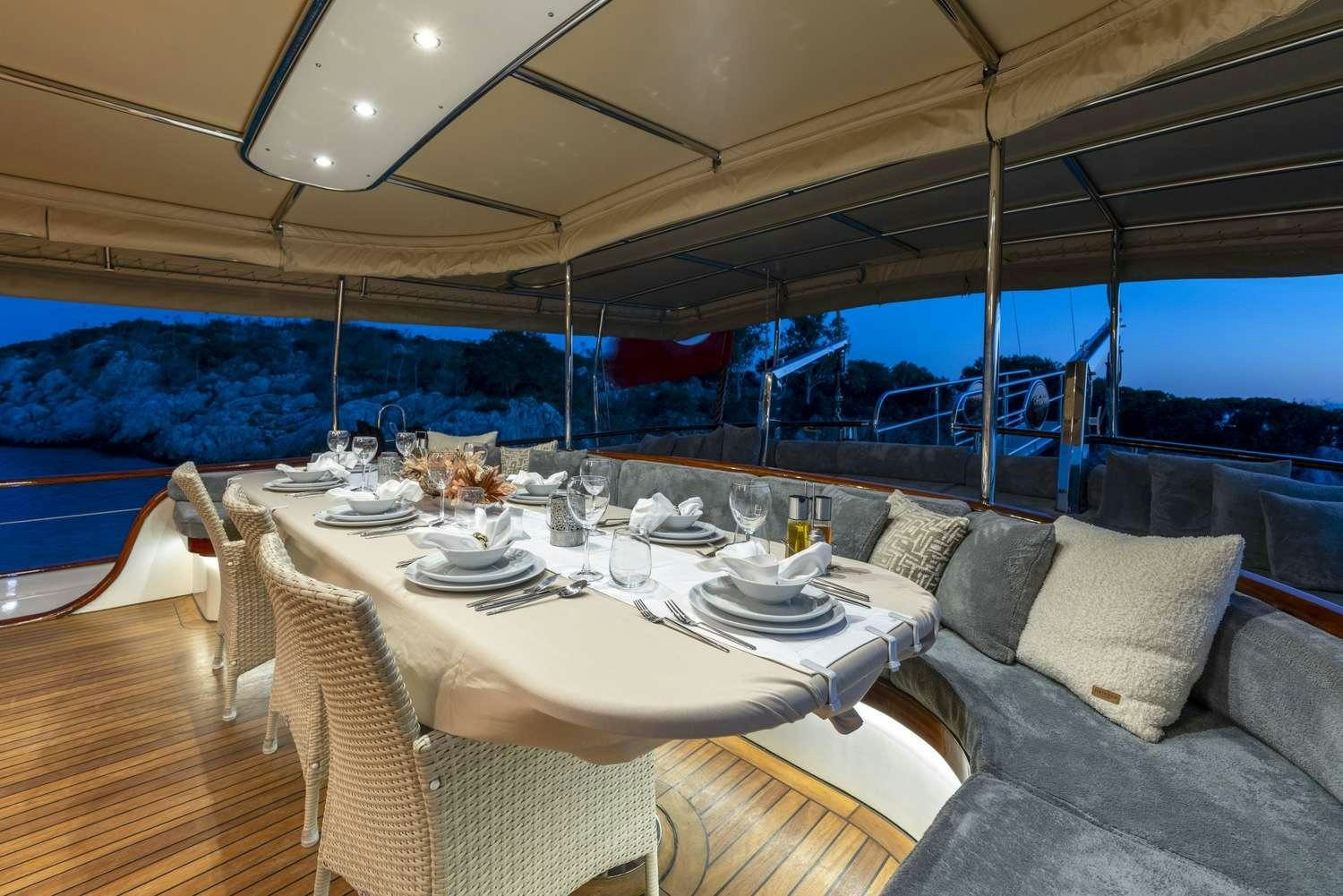 a table set for a meal aboard GOZDEM THE ONE Yacht for Charter