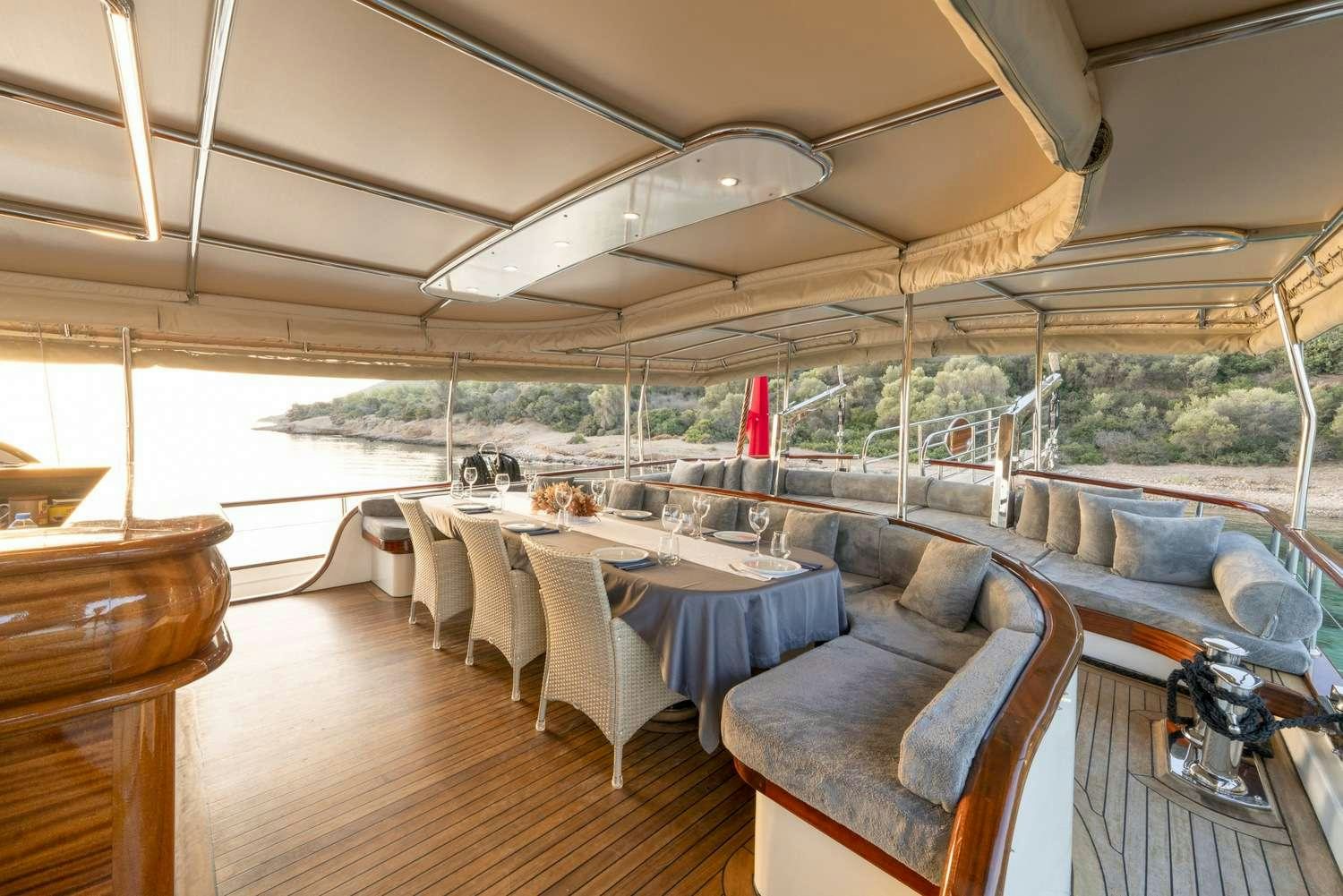 a large tent with a couch and chairs aboard GOZDEM THE ONE Yacht for Charter