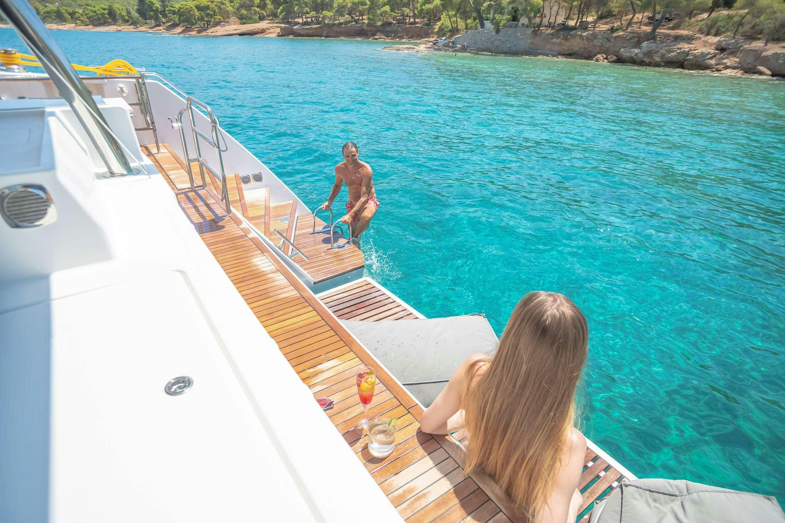 a person standing on a boat aboard D2 Yacht for Charter