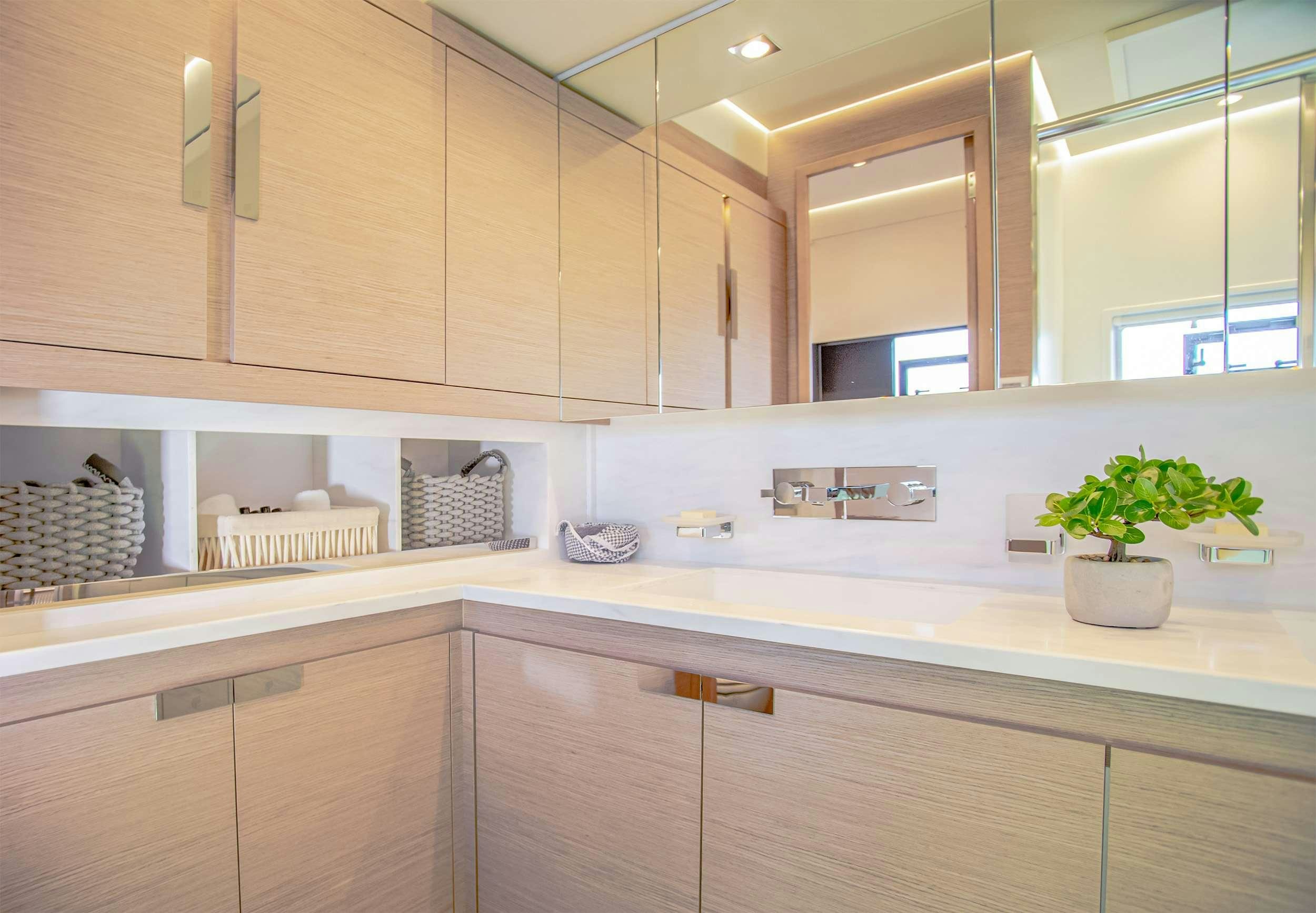 a kitchen with a large window aboard D2 Yacht for Charter