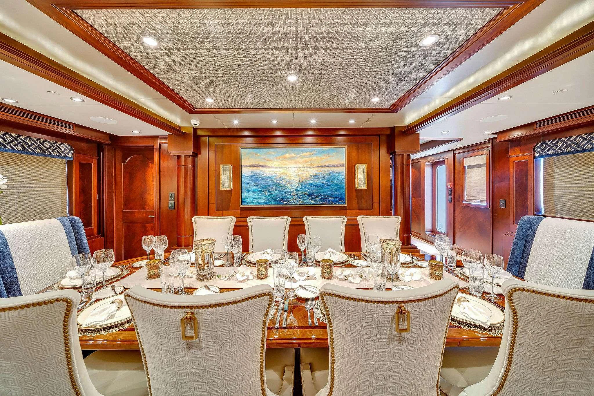 a room with tables and chairs aboard VALHALLA Yacht for Charter