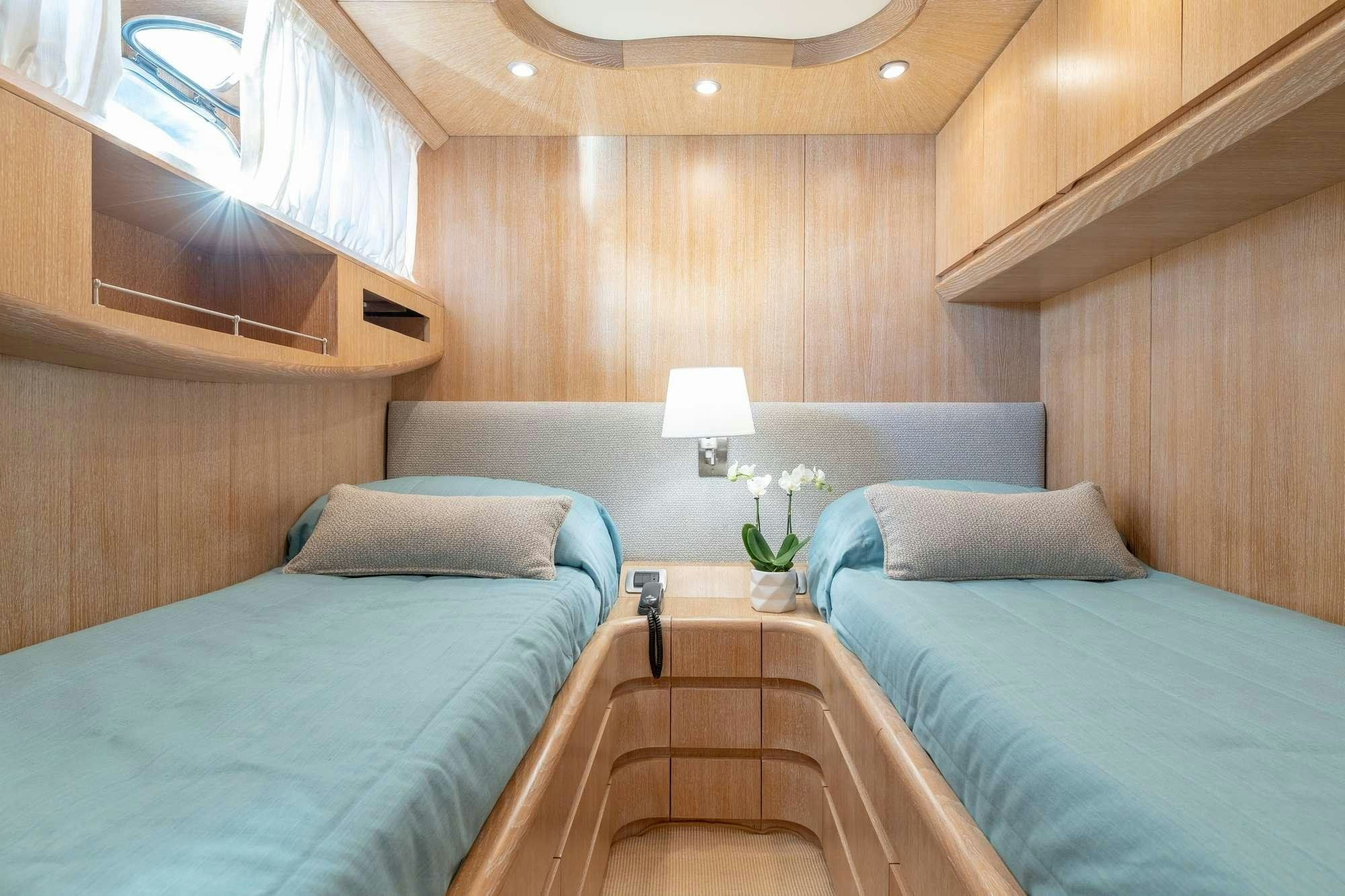 a room with two beds aboard COOKIE Yacht for Charter