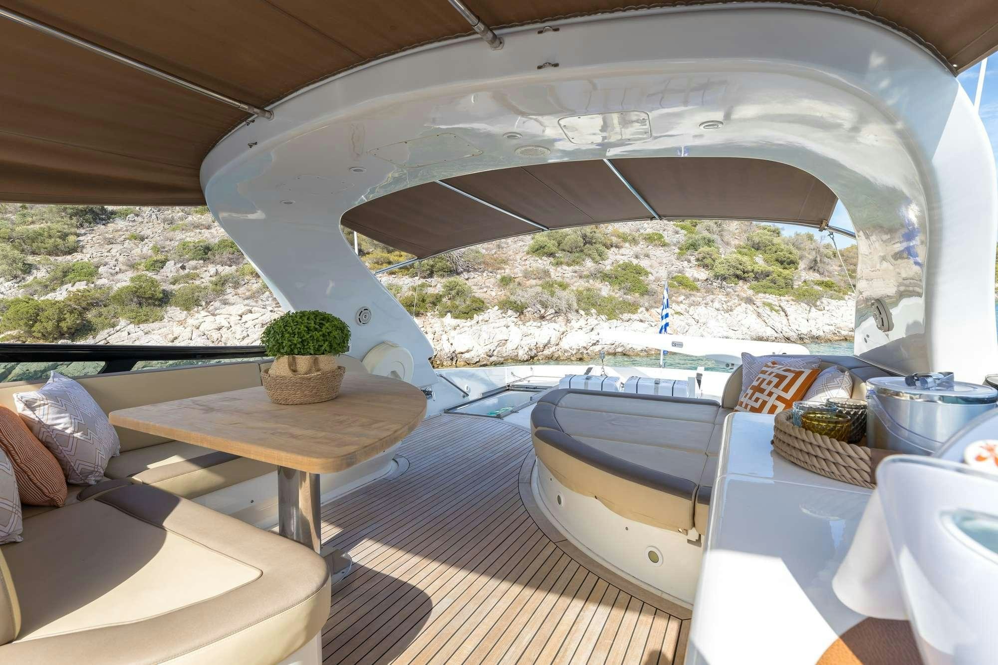 a tent with a table and a picnic table aboard COOKIE Yacht for Charter
