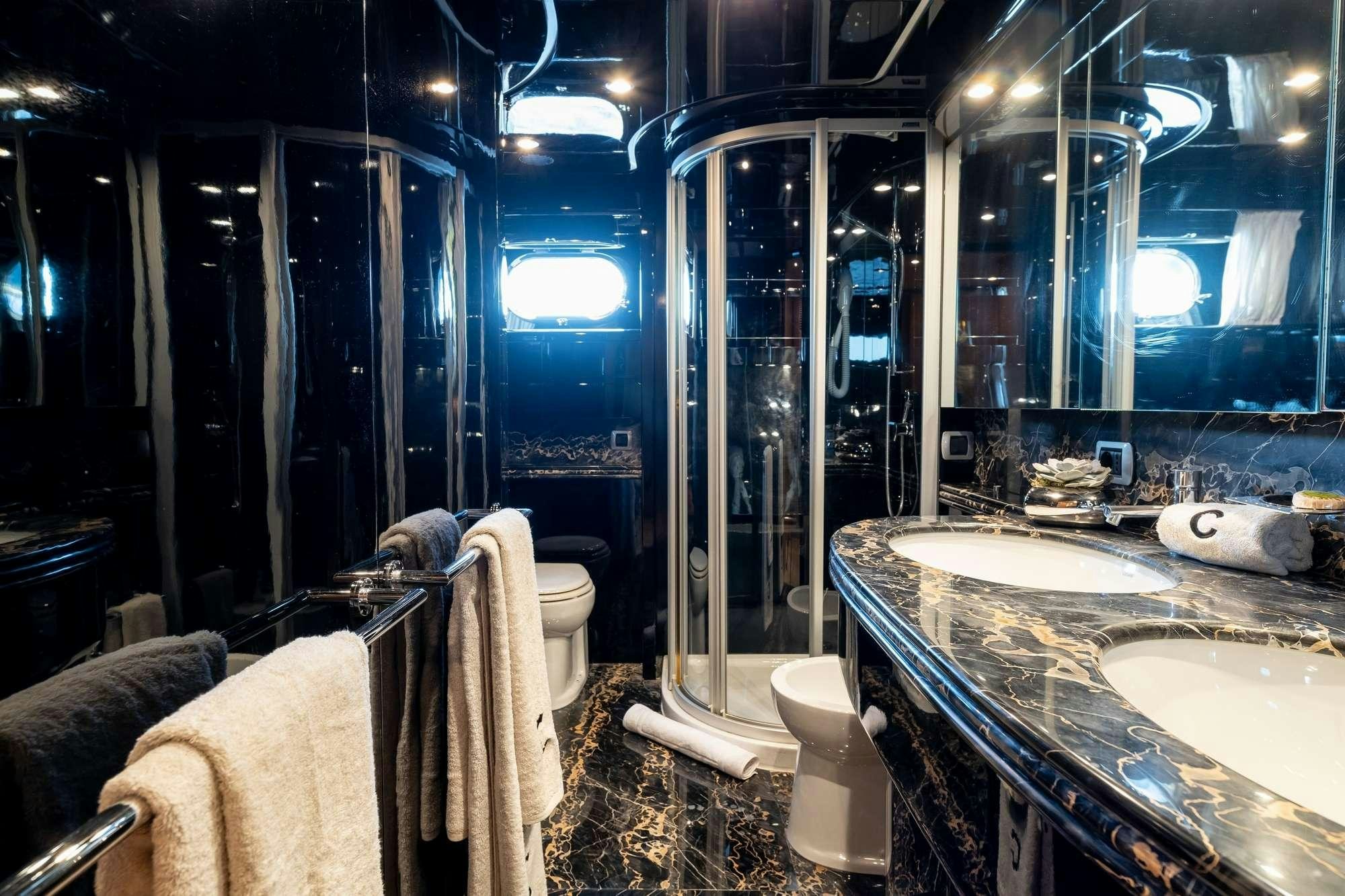 a bathroom with a large mirror aboard COOKIE Yacht for Charter