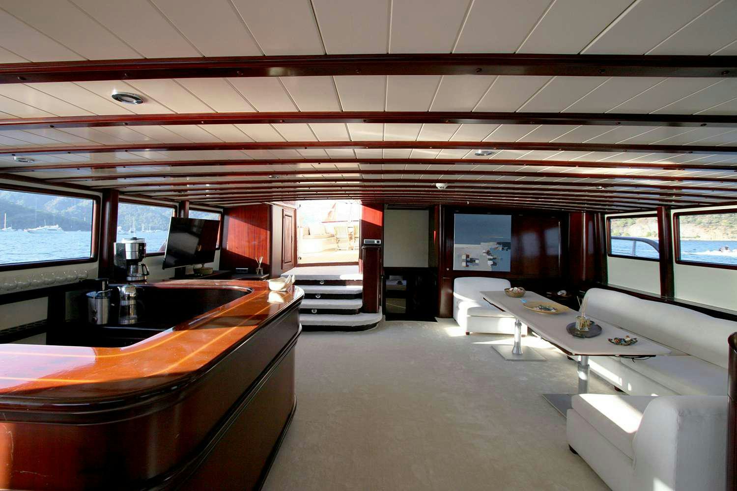 inside of a building with a large window and a large open door aboard ALWAYS SMILE Yacht for Charter
