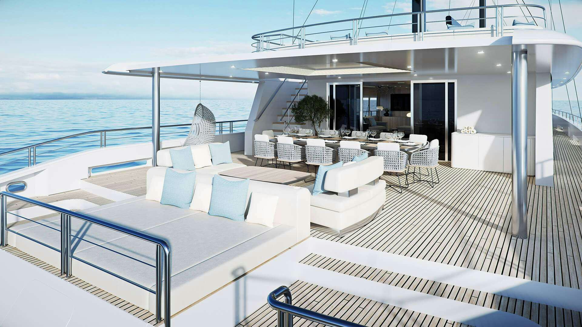 a large white lounge area with a pool and a large white lounge chair aboard ADRI Yacht for Charter