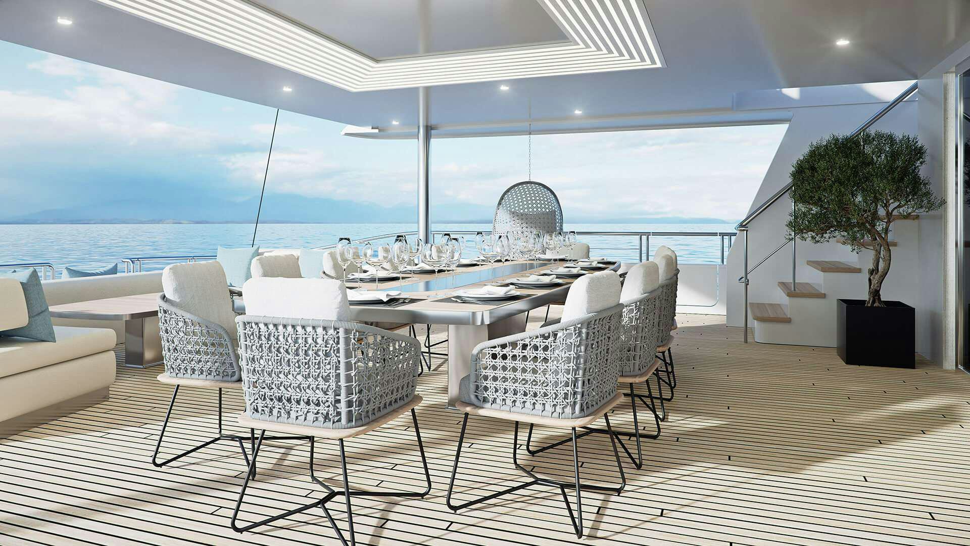 a room with a table chairs and a plant on the table aboard ADRI Yacht for Charter