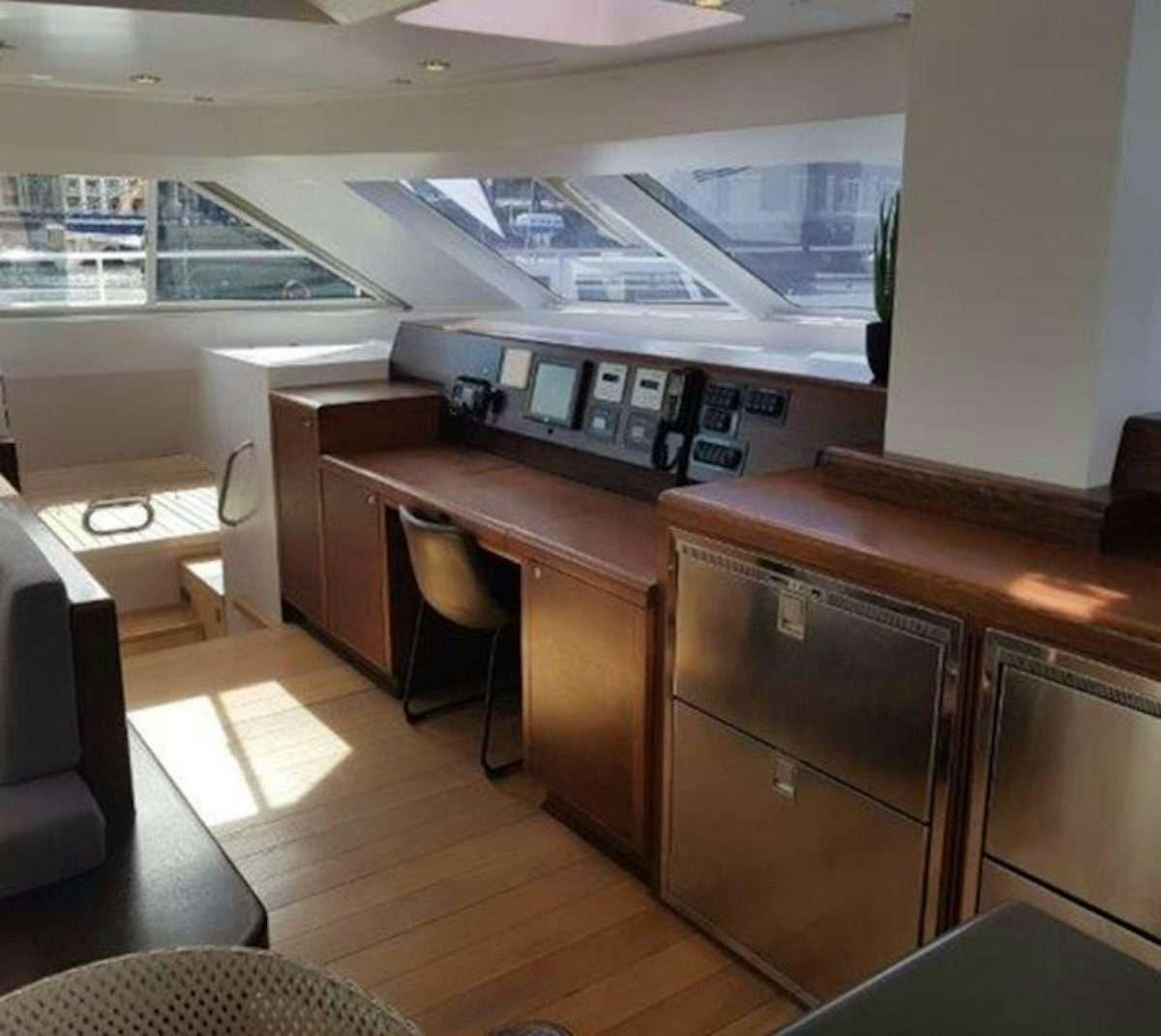 a room with a desk and a computer aboard HQ2 Yacht for Charter