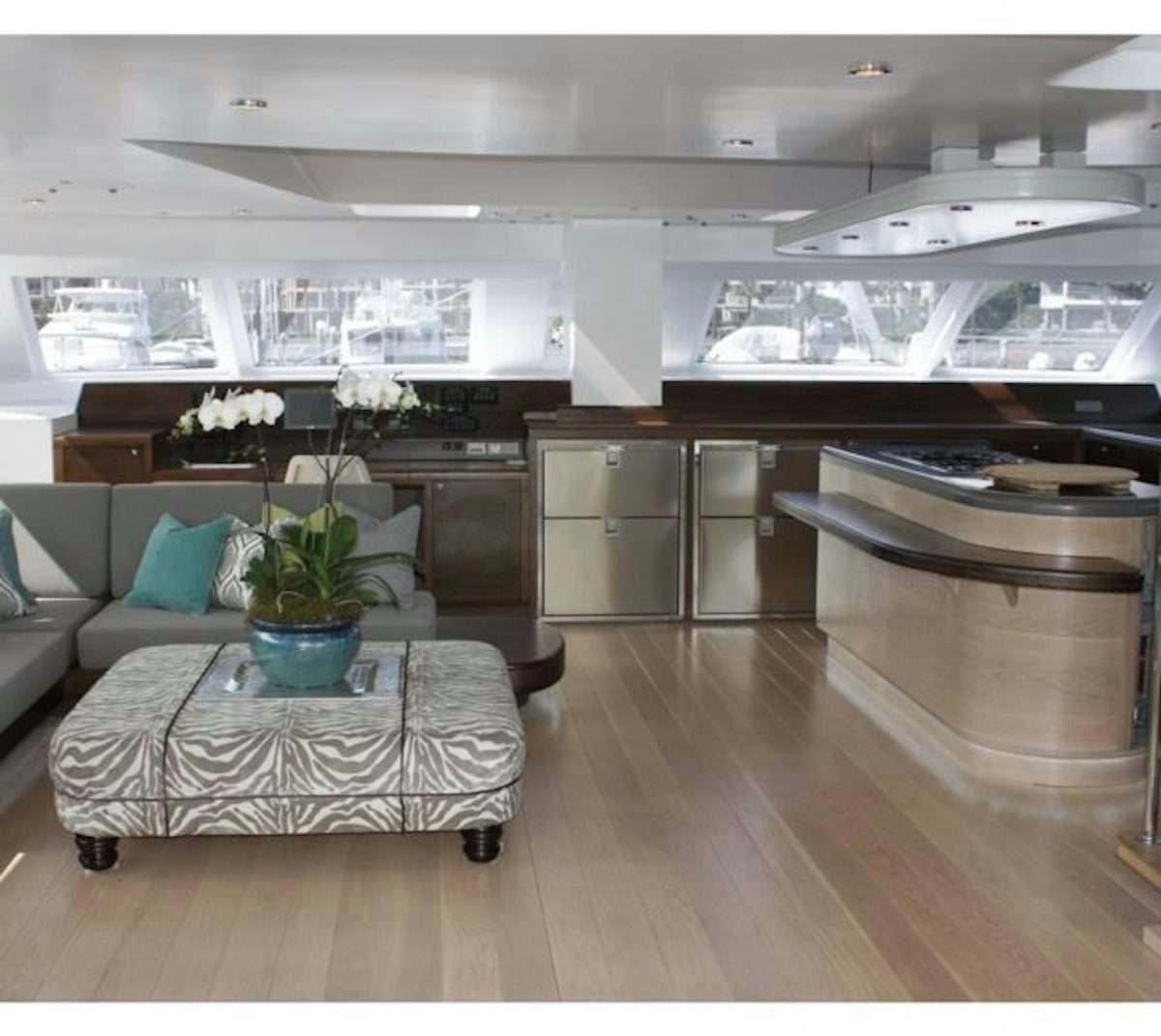 a modern looking kitchen with a large open floor plan aboard HQ2 Yacht for Charter