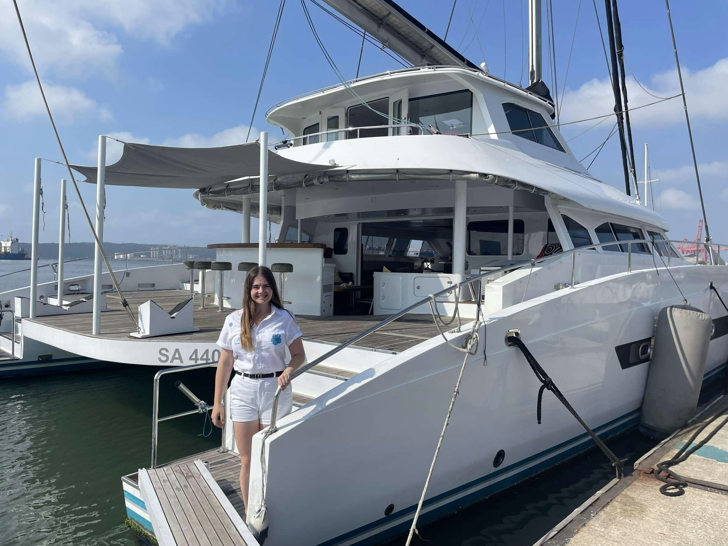 a person standing on a boat aboard HQ2 Yacht for Charter
