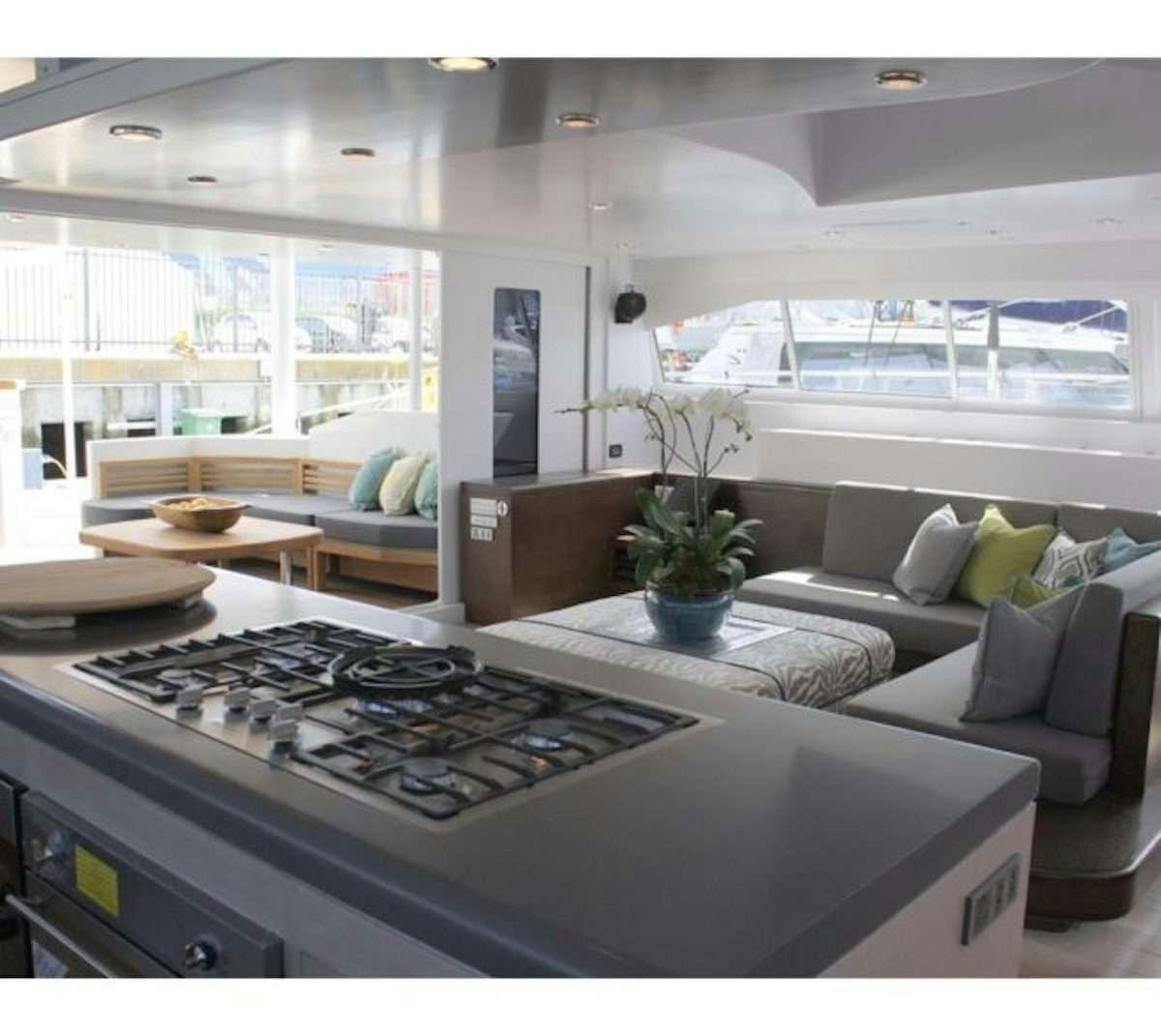a kitchen with a stove aboard HQ2 Yacht for Charter