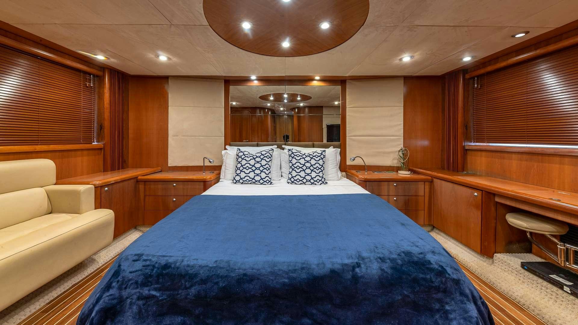 a large bed in a room aboard AQUAHOLIC Yacht for Charter