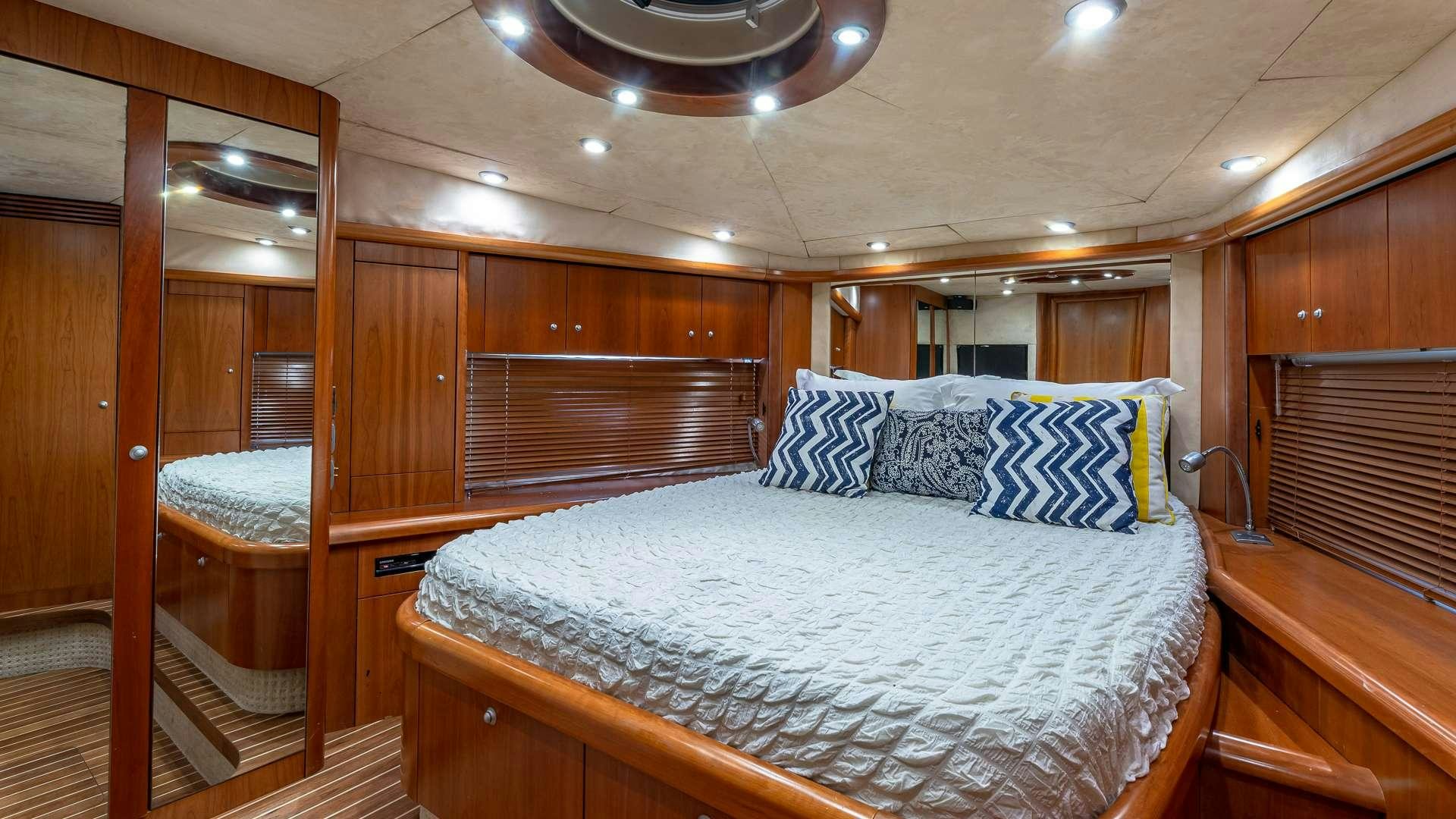 a bed in a cabin aboard AQUAHOLIC Yacht for Charter