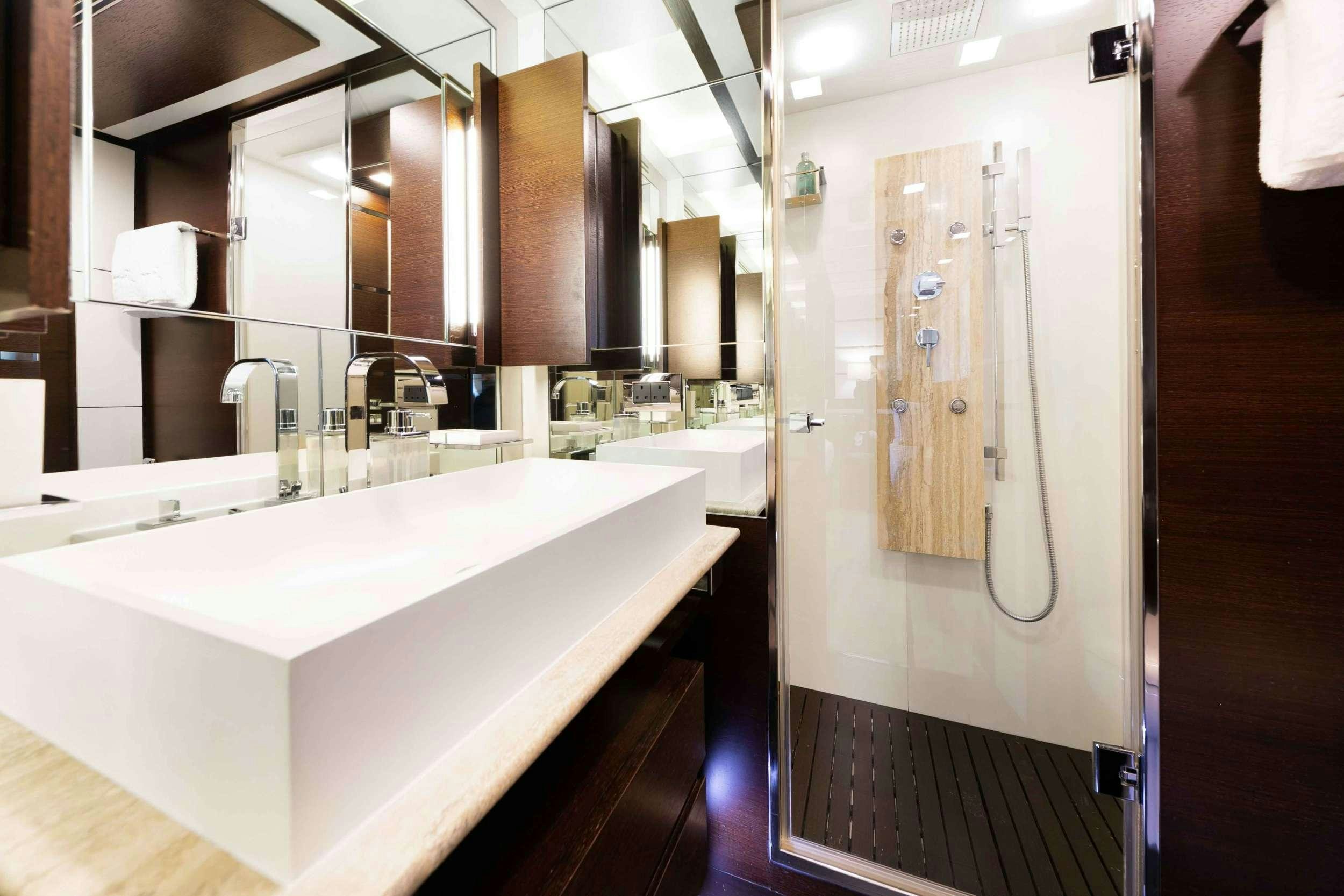 a bathroom with a sink and a mirror aboard CAMY ED Yacht for Charter