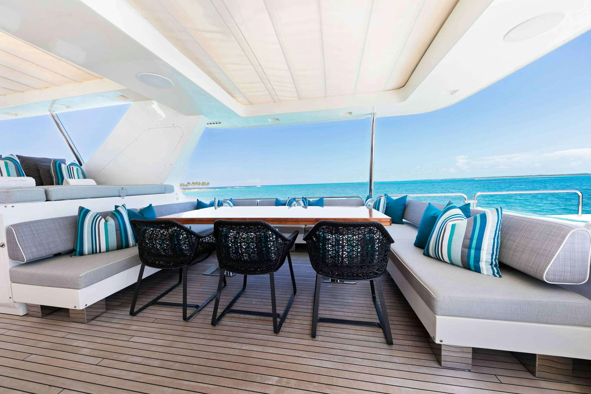 a room with a couch and a table and chairs aboard CAMY ED Yacht for Charter