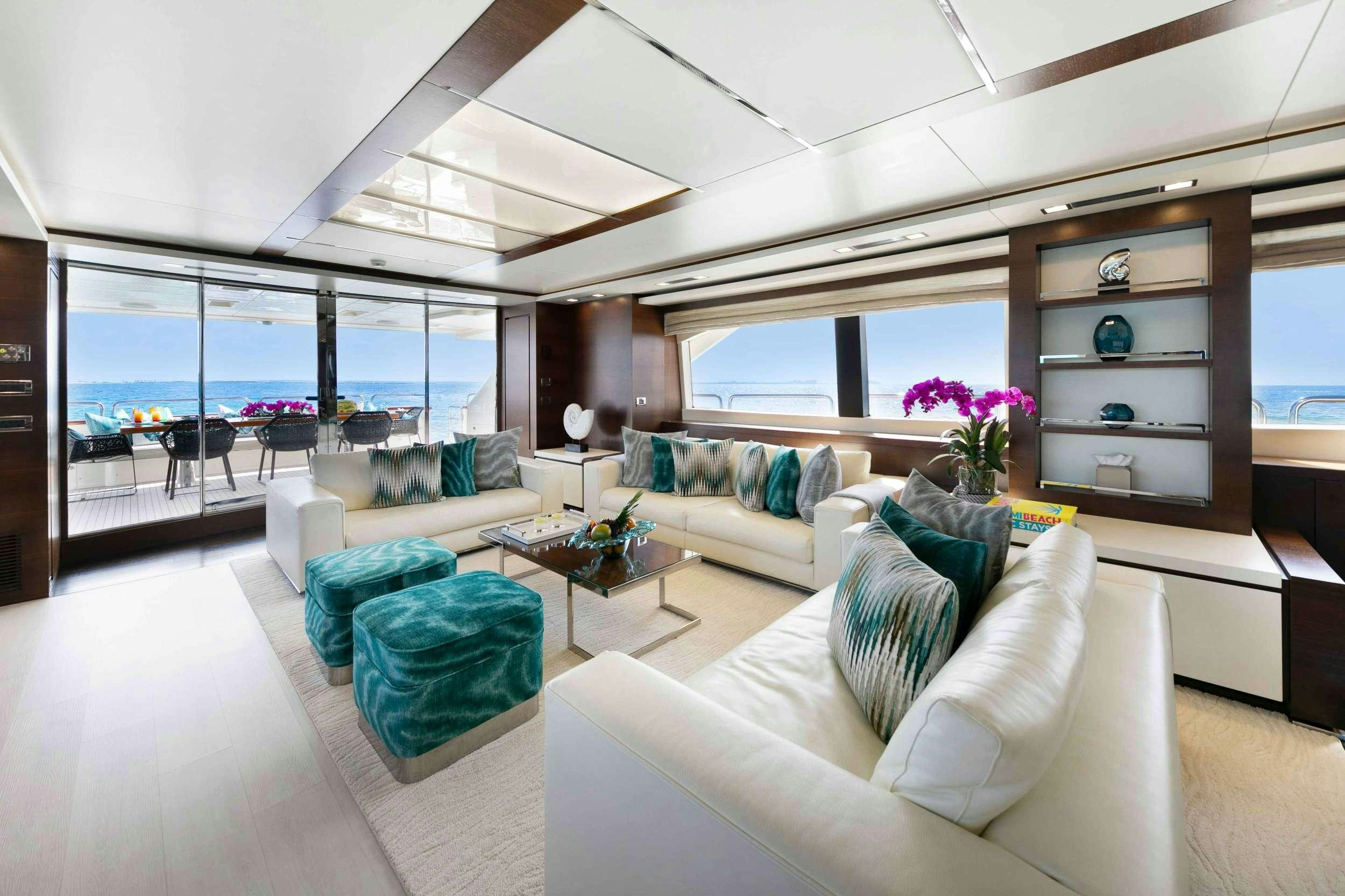 a living room with a large window aboard CAMY ED Yacht for Charter