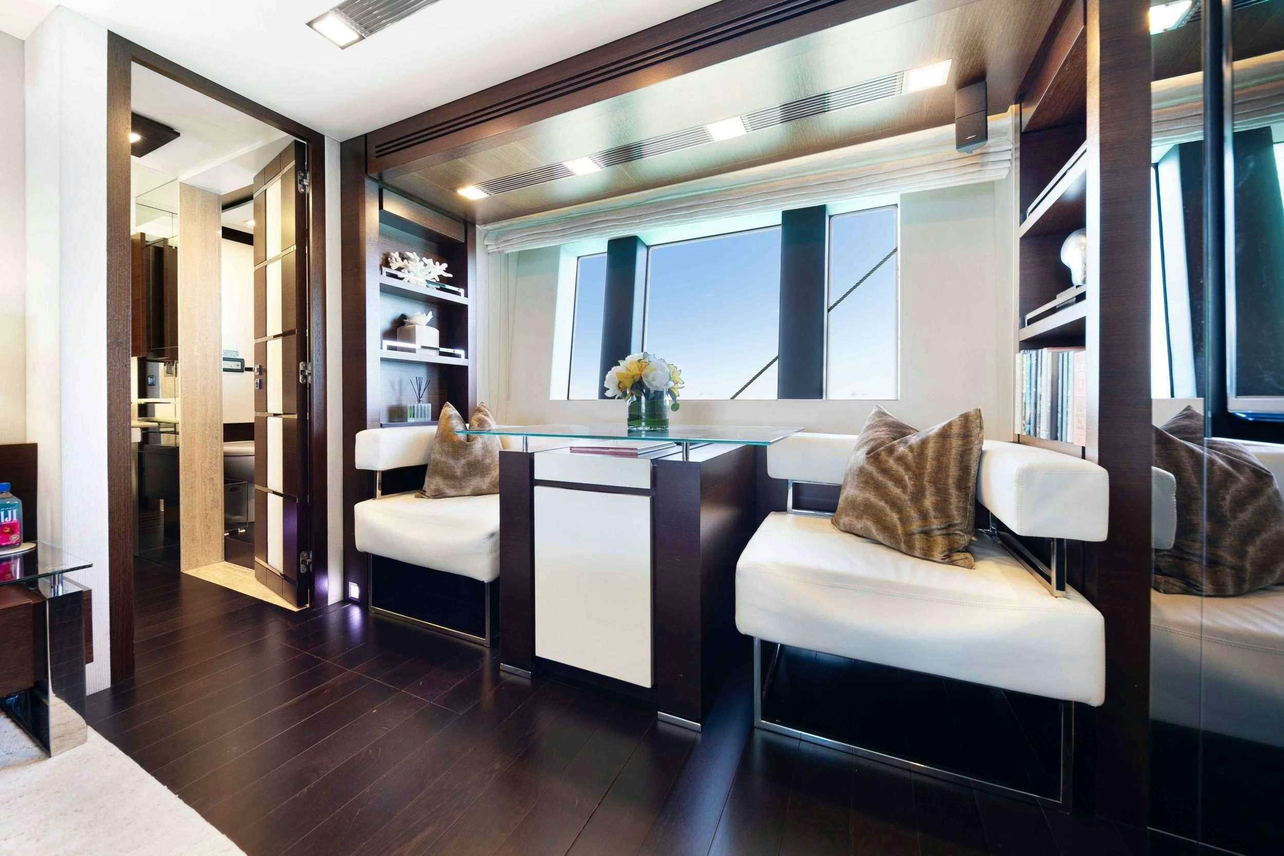 a room with a table and chairs aboard CAMY ED Yacht for Charter
