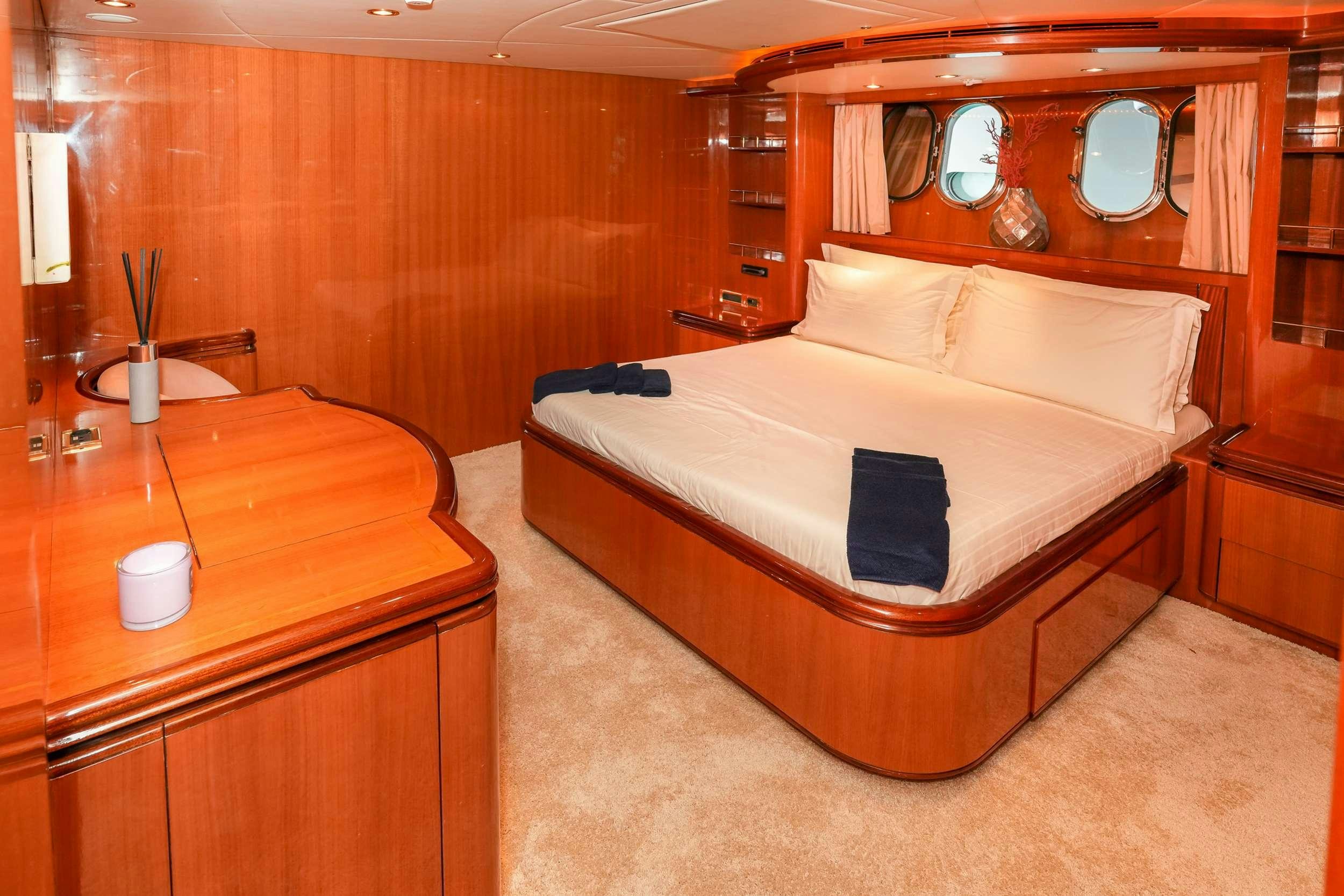 a bed in a room aboard CONTE STEFANI Yacht for Charter