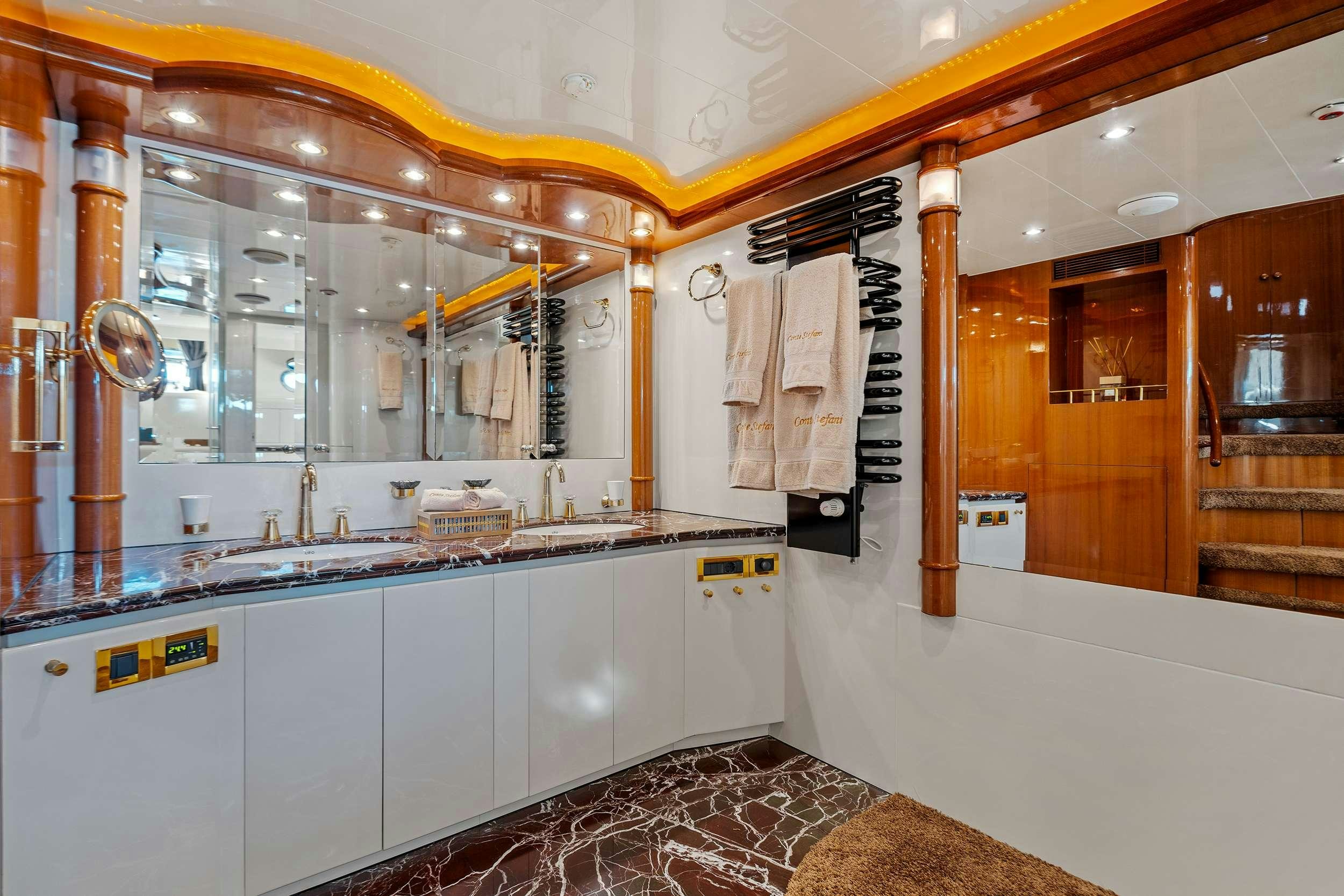 a bathroom with a large mirror aboard CONTE STEFANI Yacht for Charter