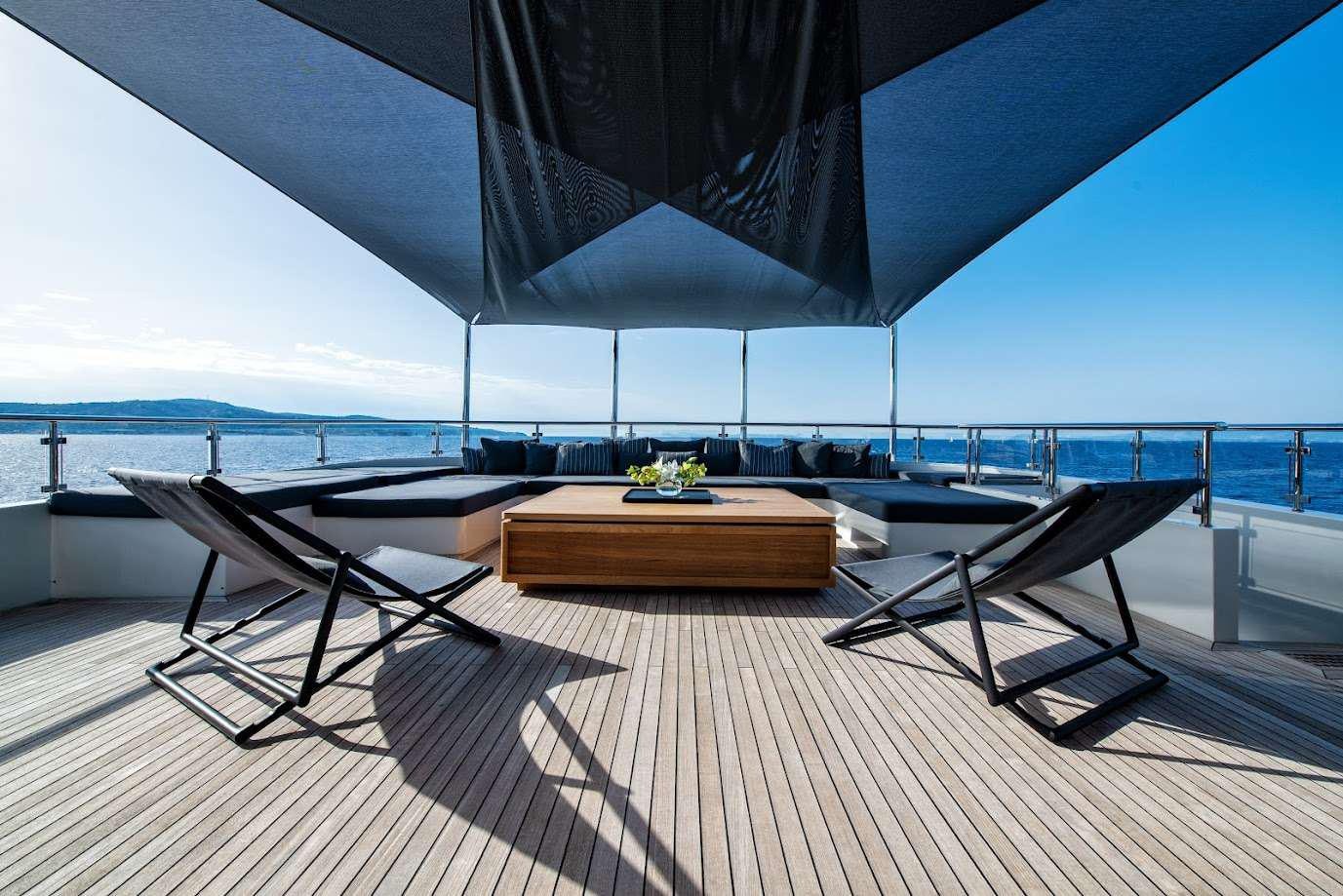 a room with a table and chairs aboard ZIA Yacht for Charter
