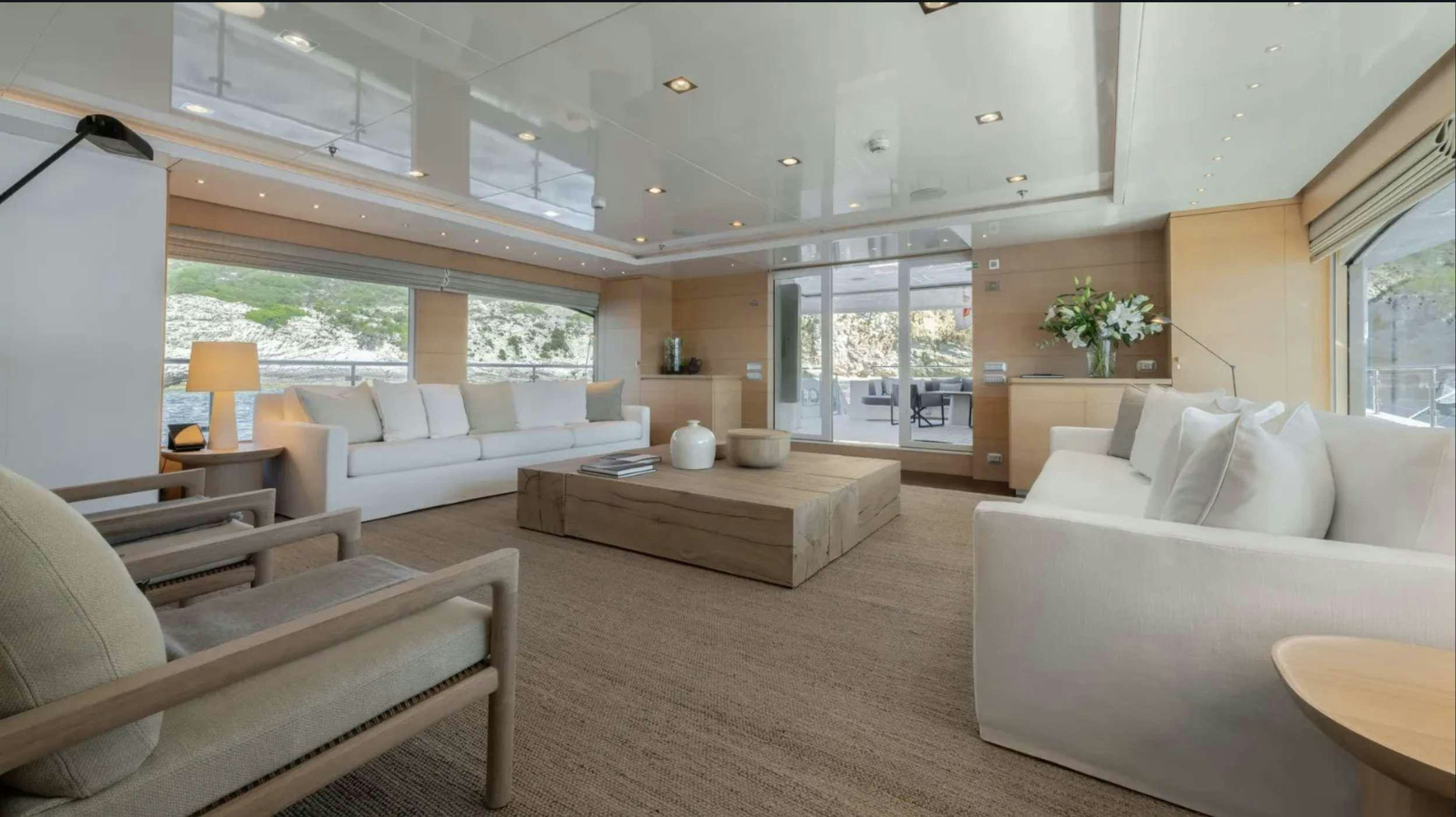 a living room with a couch and a table aboard ZIA Yacht for Charter