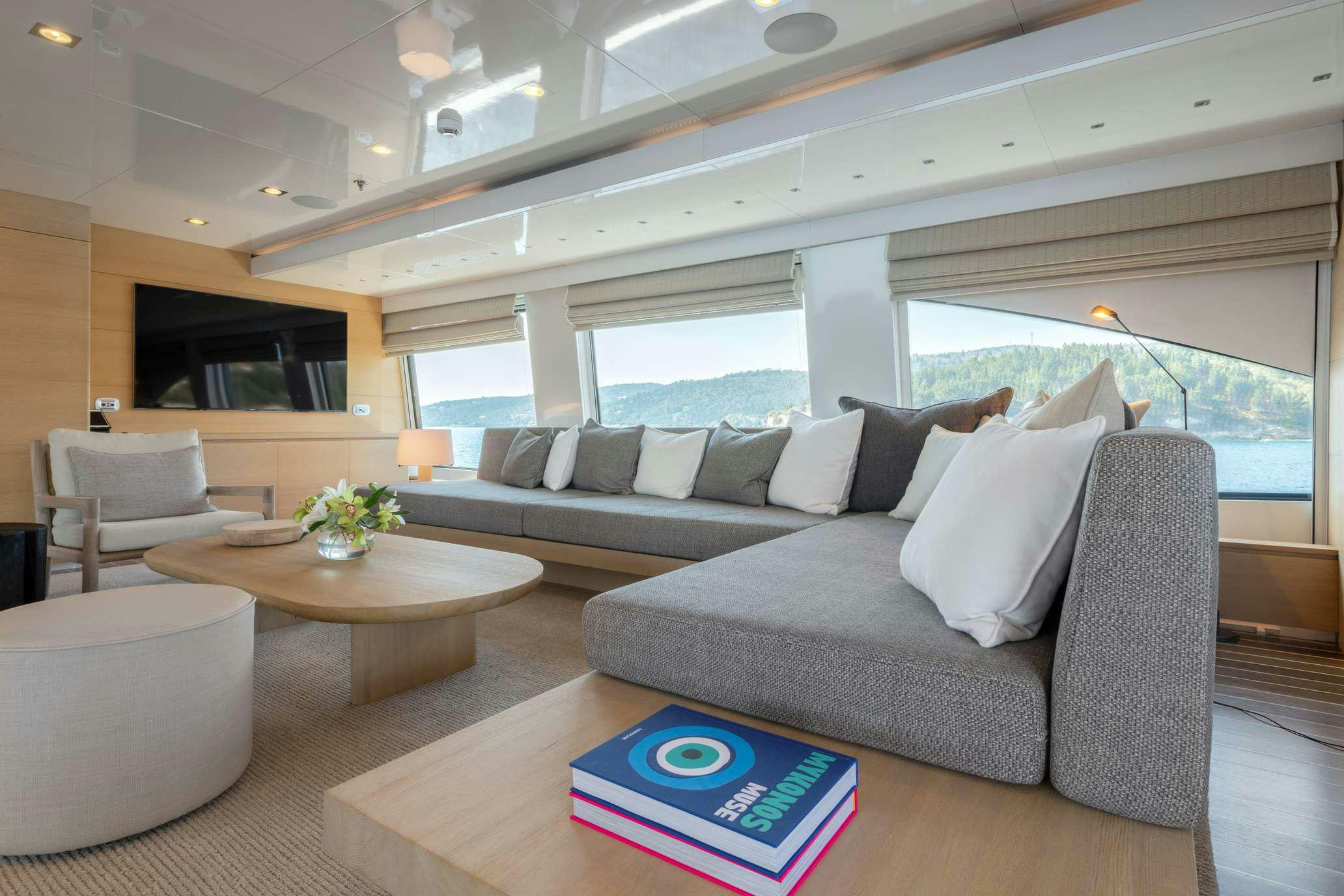 a living room with a couch and a table aboard ZIA Yacht for Charter