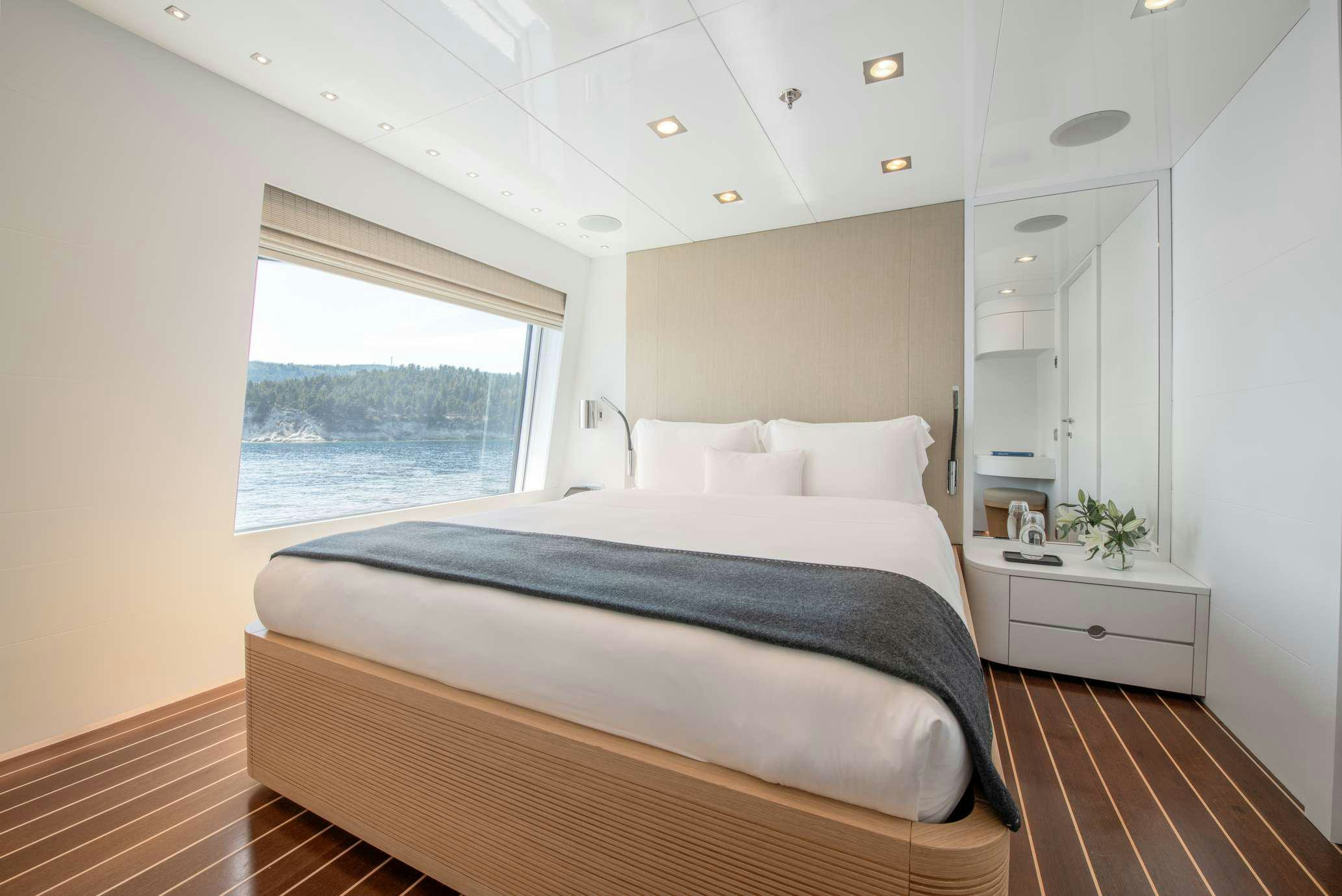 a bedroom with a large bed aboard ZIA Yacht for Charter