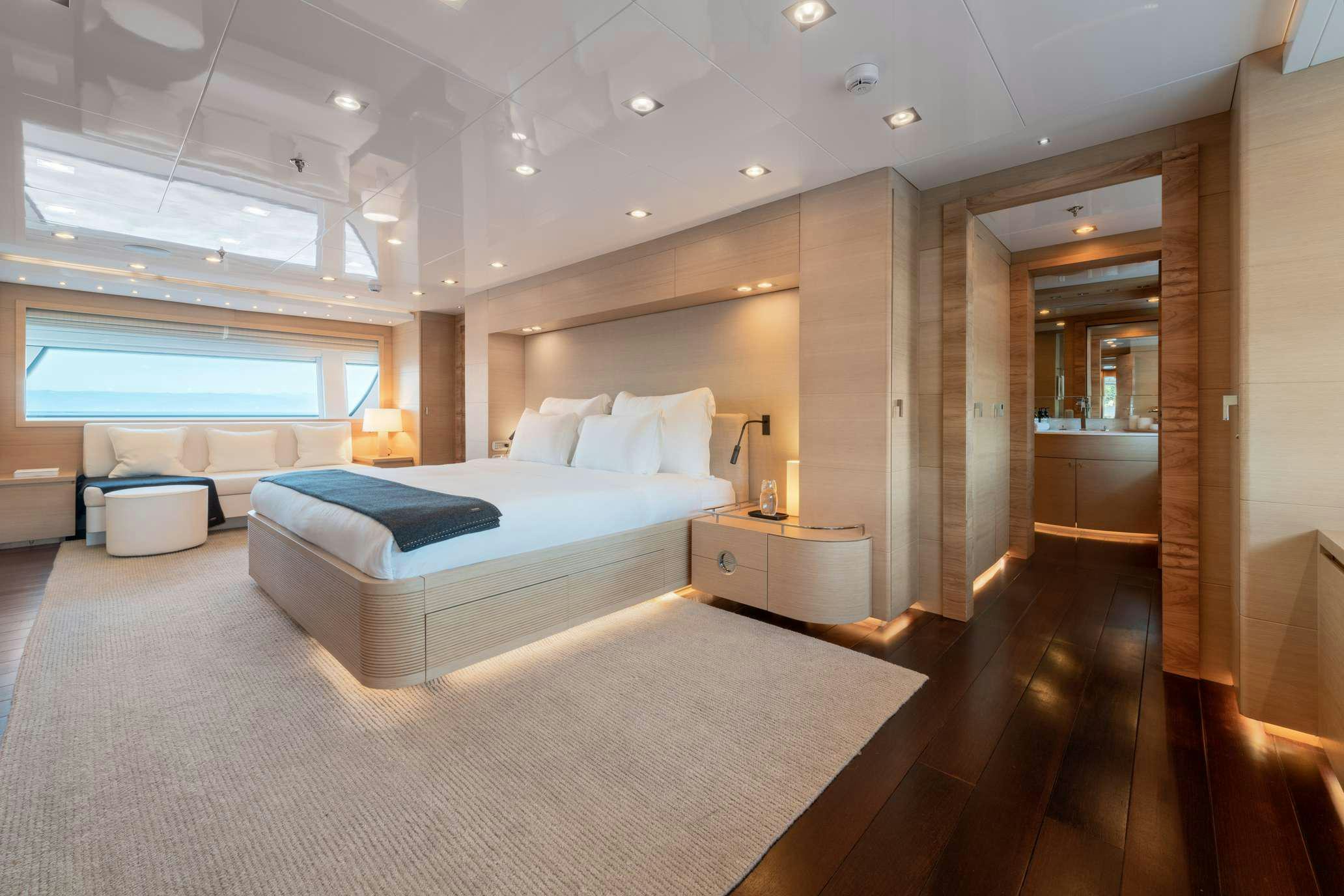 a large bedroom with a large bed aboard ZIA Yacht for Charter