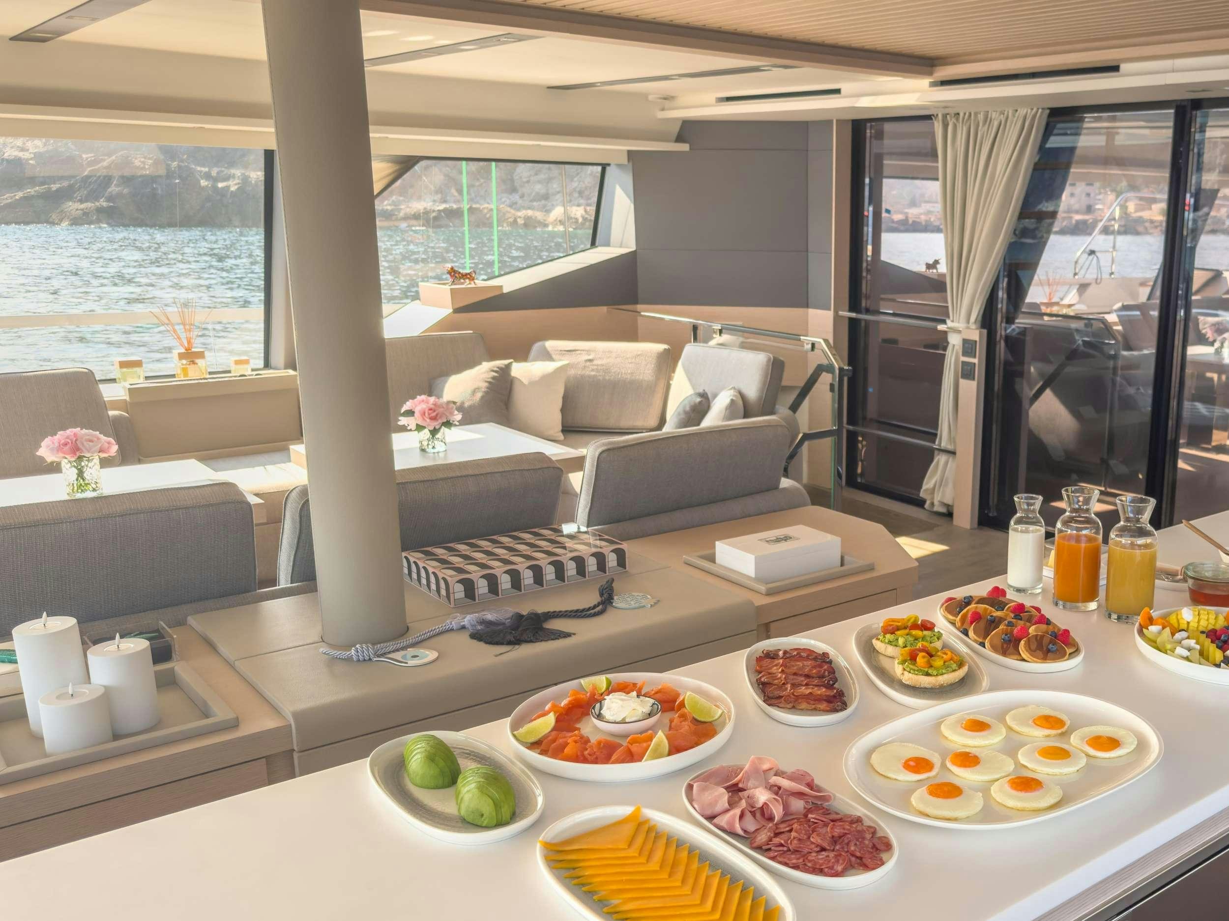a table with food on it aboard SERENISSIMA III Yacht for Charter