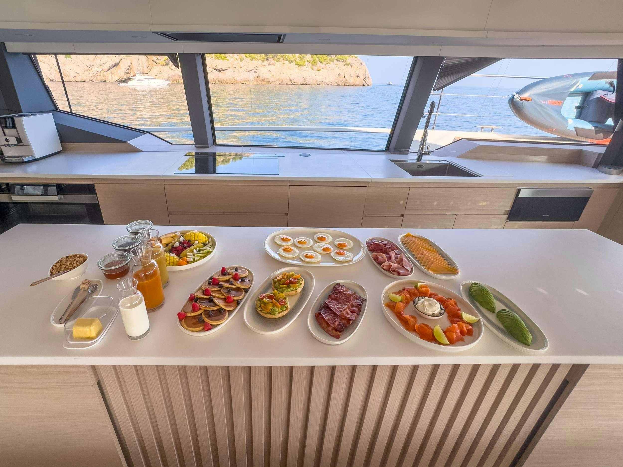 a table with food on it aboard SERENISSIMA III Yacht for Charter