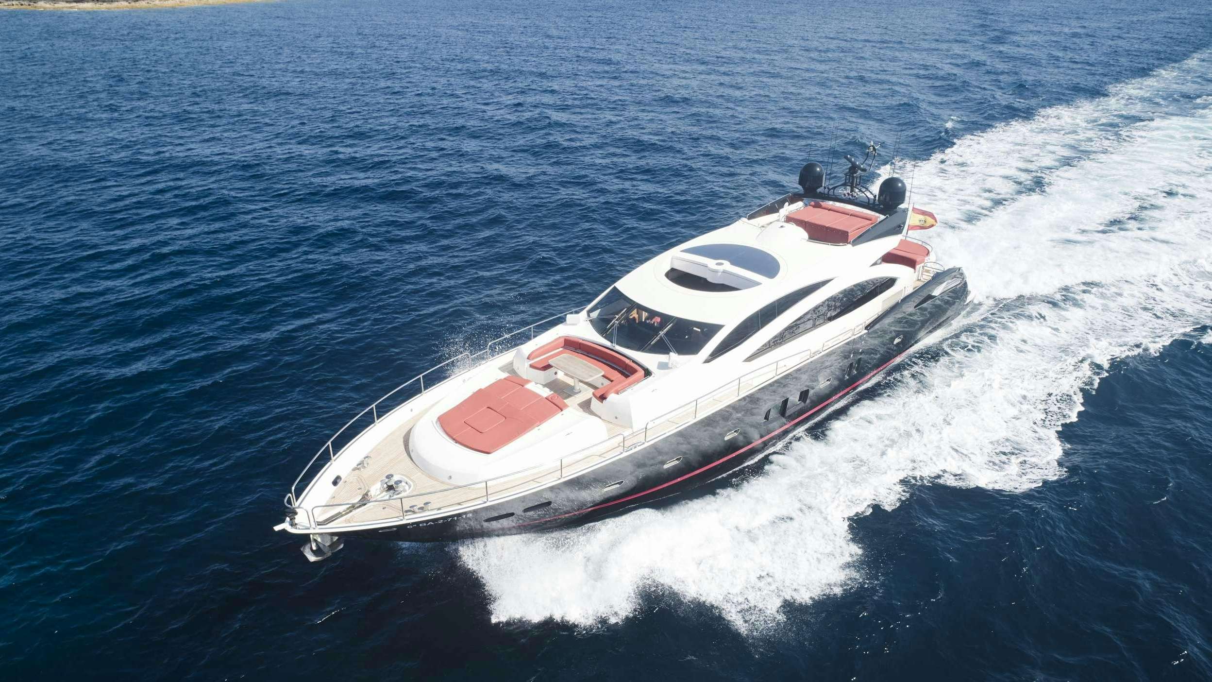 a white and red boat in the water aboard UM7 Yacht for Charter