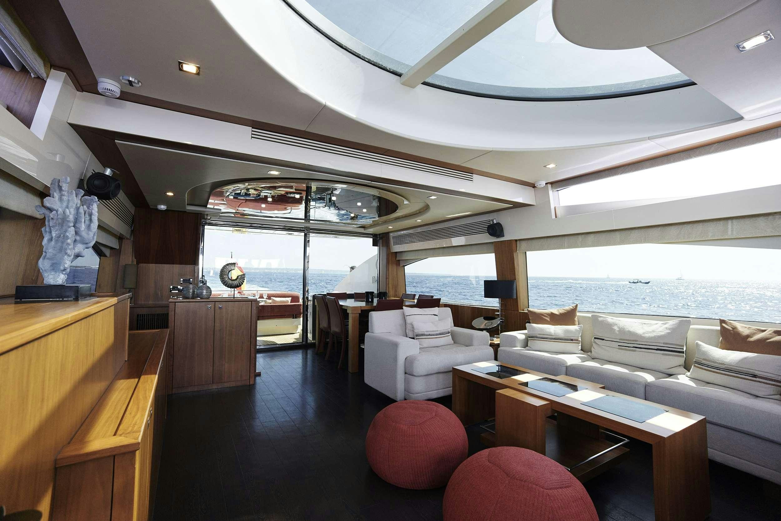 a room with a large window and a view of the ocean aboard UM7 Yacht for Charter