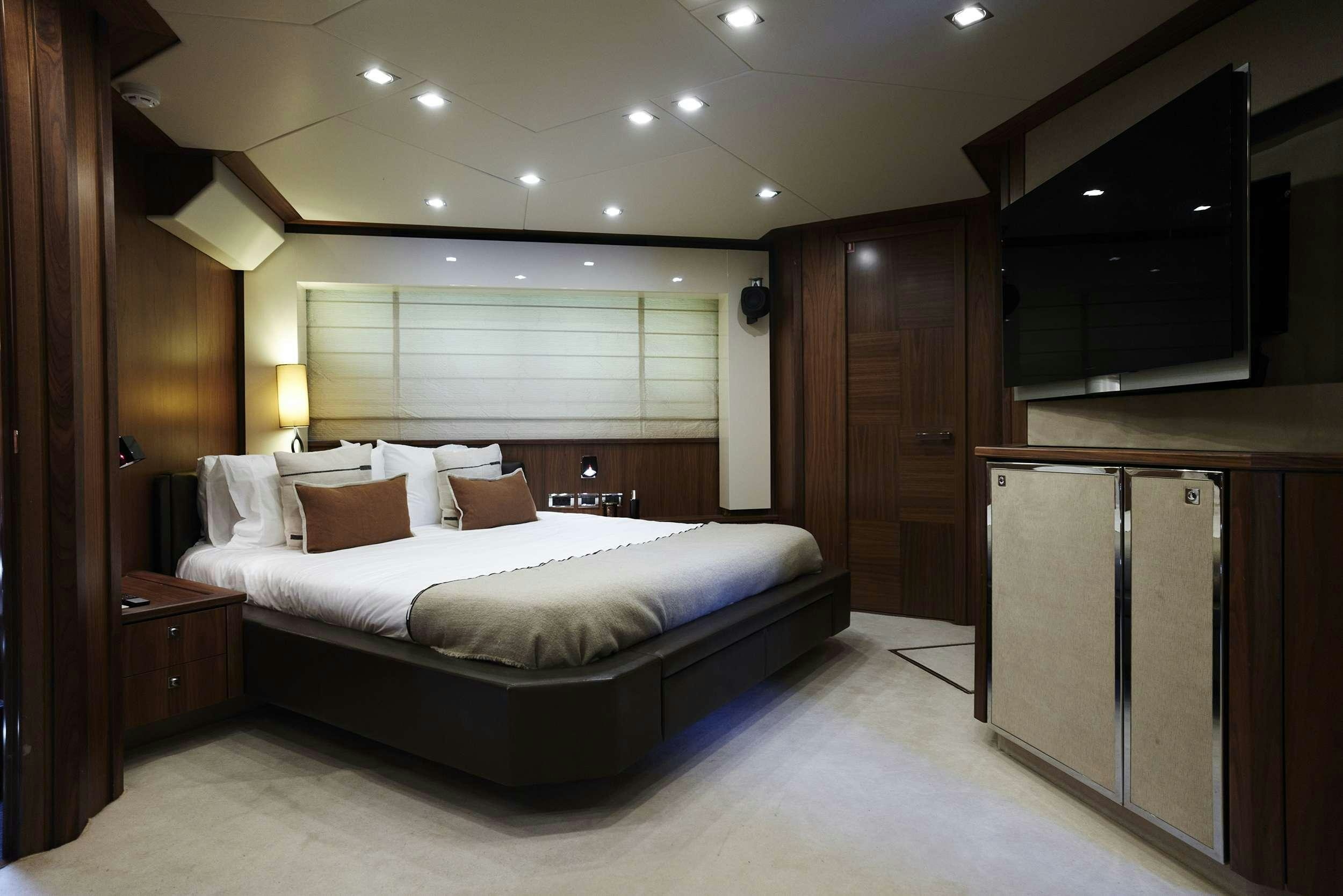 a large bed in a hotel room aboard UM7 Yacht for Charter