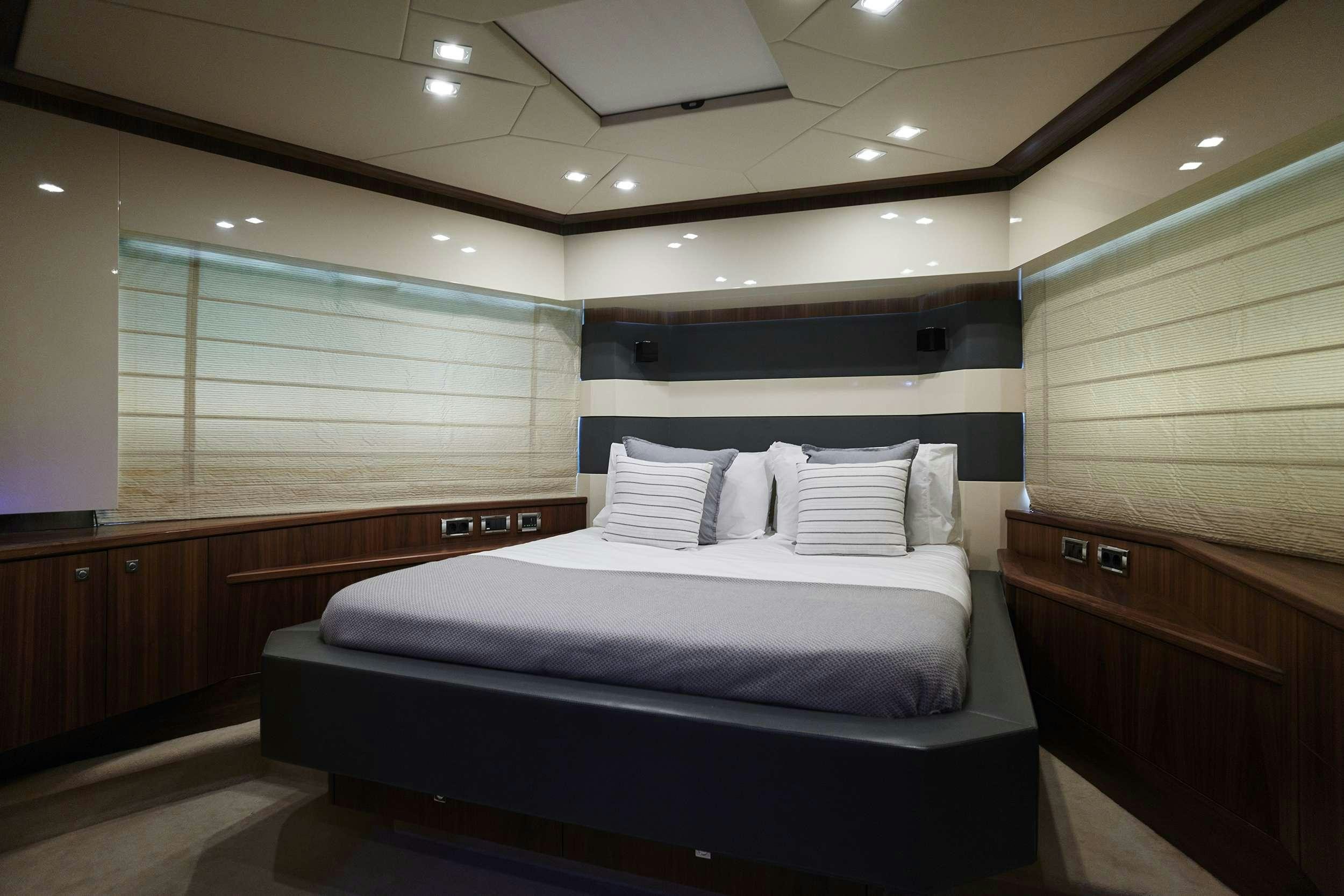 a room with a bed and a window aboard UM7 Yacht for Charter