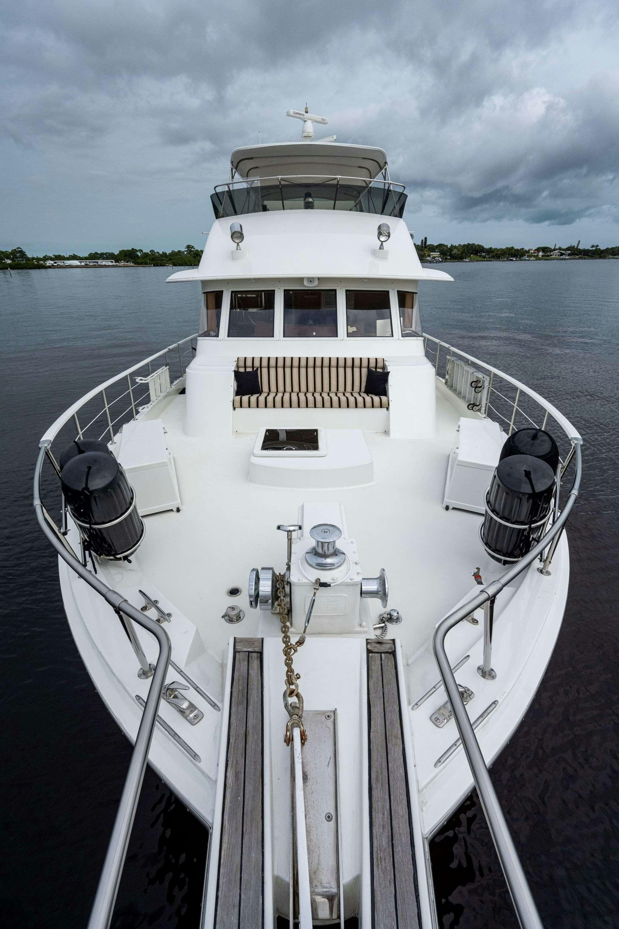a white boat with a rope attached aboard BANDIT Yacht for Charter