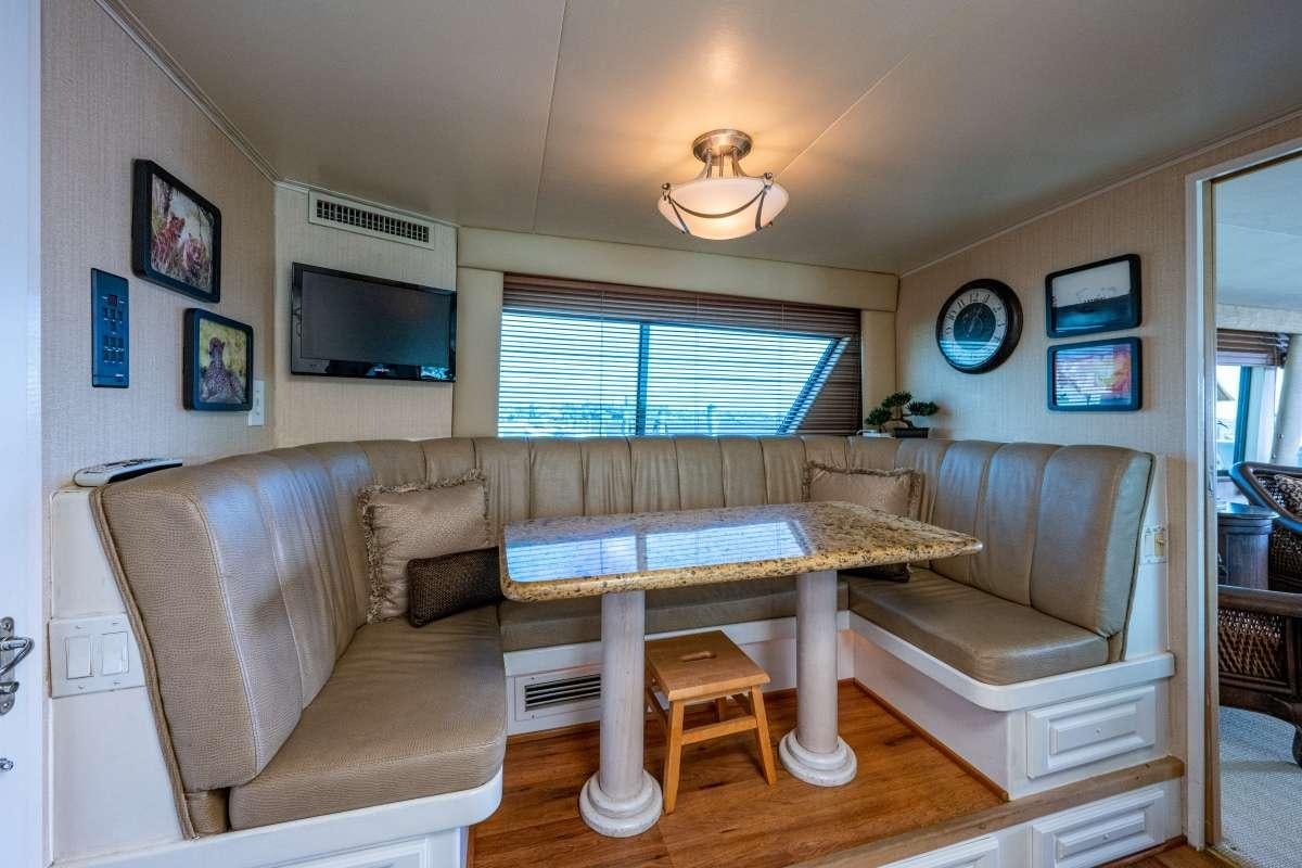 a living room with a couch and a table aboard BANDIT Yacht for Charter