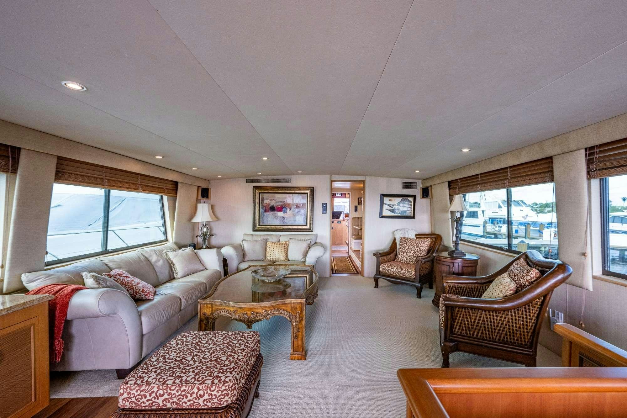 a living room with a couch and a table aboard BANDIT Yacht for Charter
